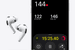 Wireless earbuds with built-in health sensors resting beside a charging case