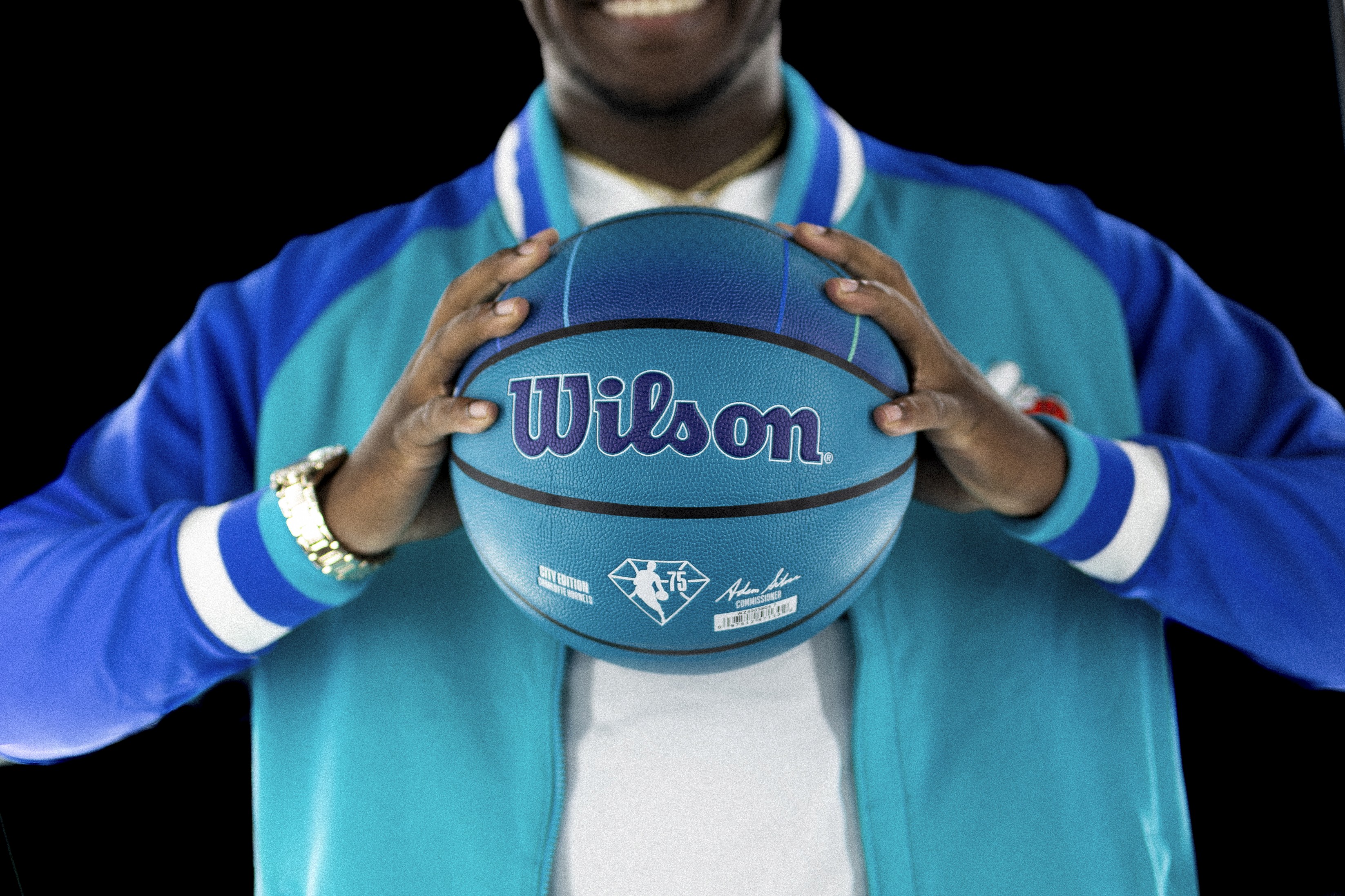 Clifford Taylor IV  flexing new Wilson Charlotte Hornets Basketball during branded campaign shoot in Los Angeles photos taken by Johnny Baru Media
