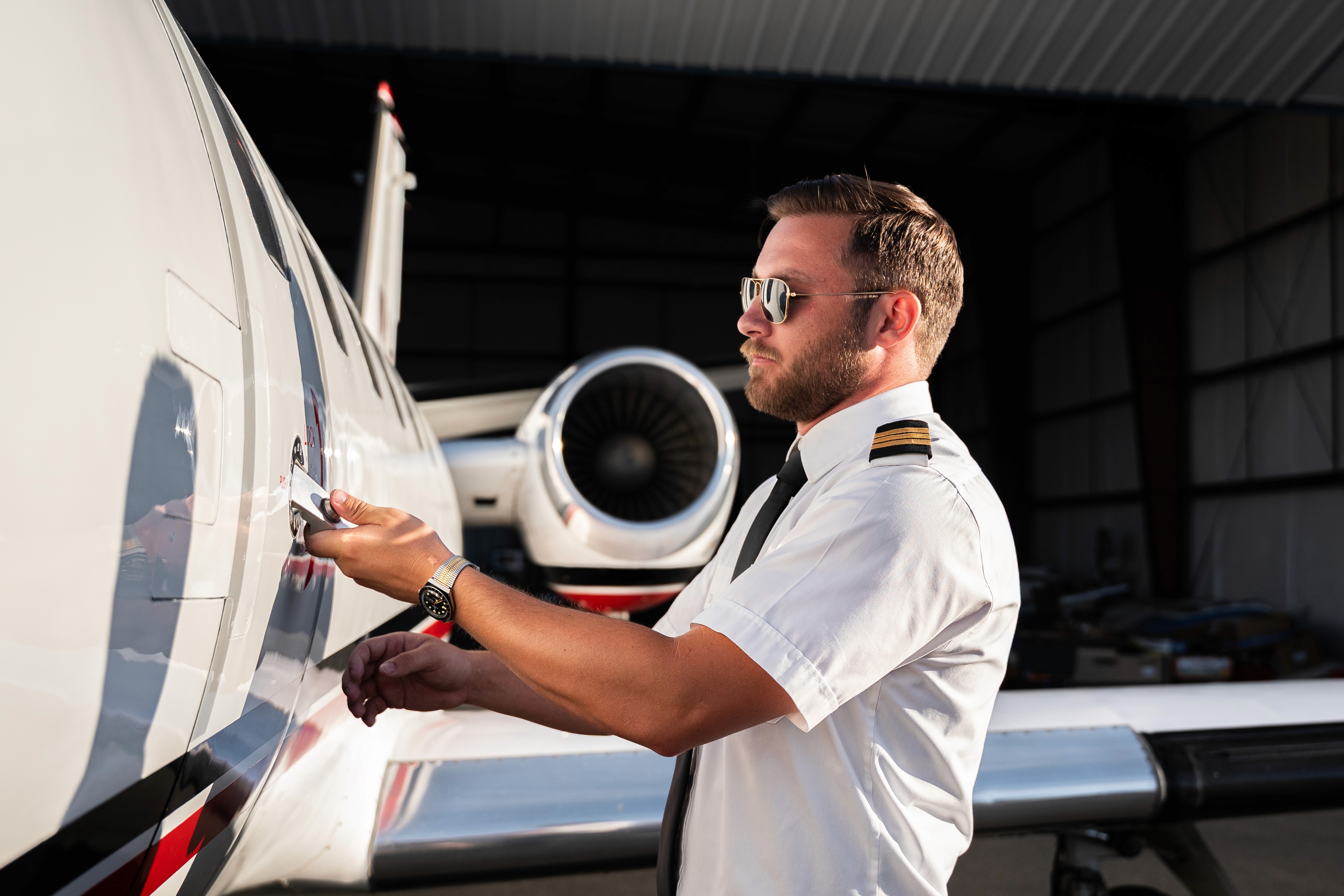 A close-up of a black credit card placed on a speckled surface next to a cup of coffee.