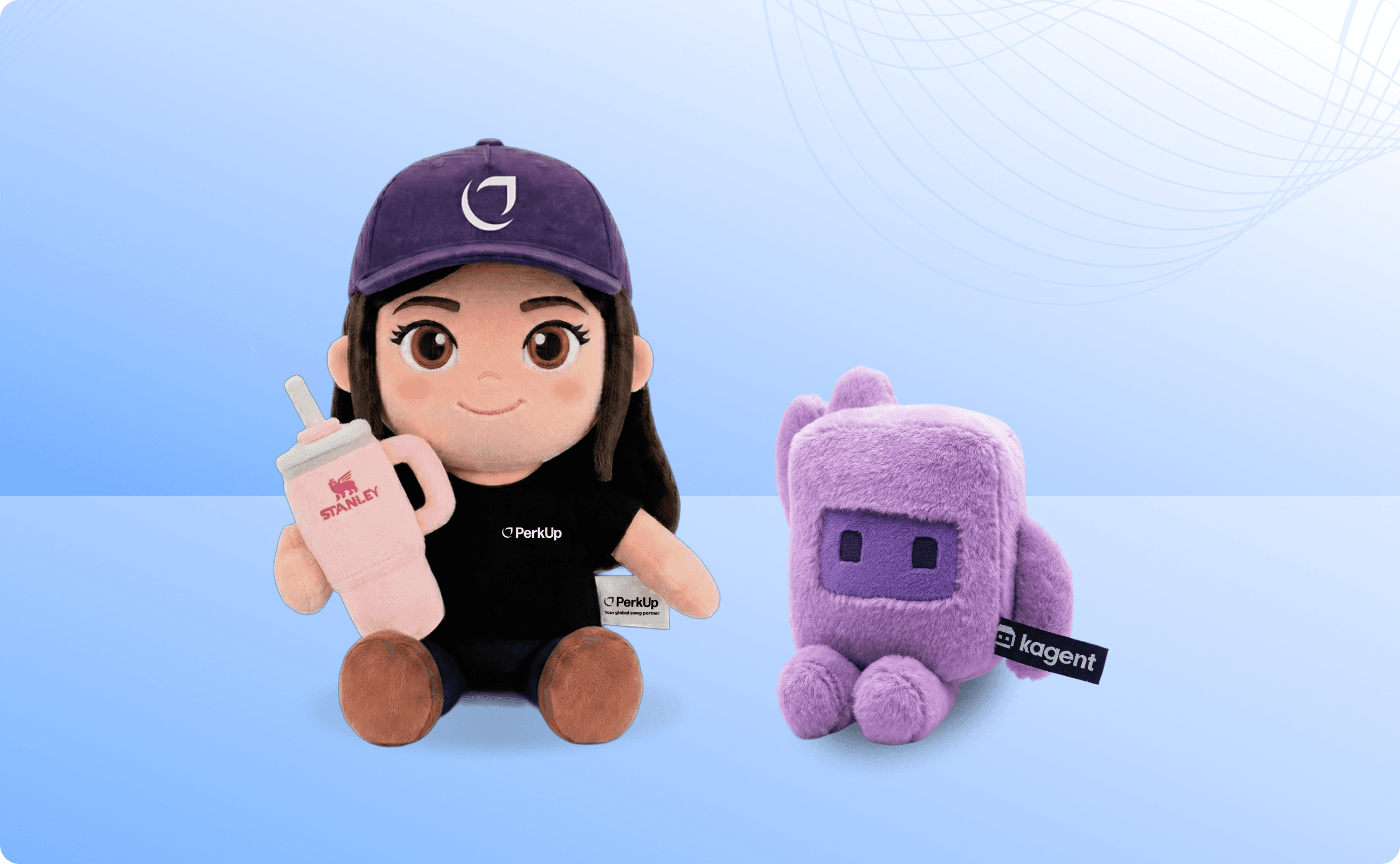 A custom girl plushie holding a Stanley cup and wearing a hat with a PerkUp logo. Beside it, there's a violet plushie from Kagent.