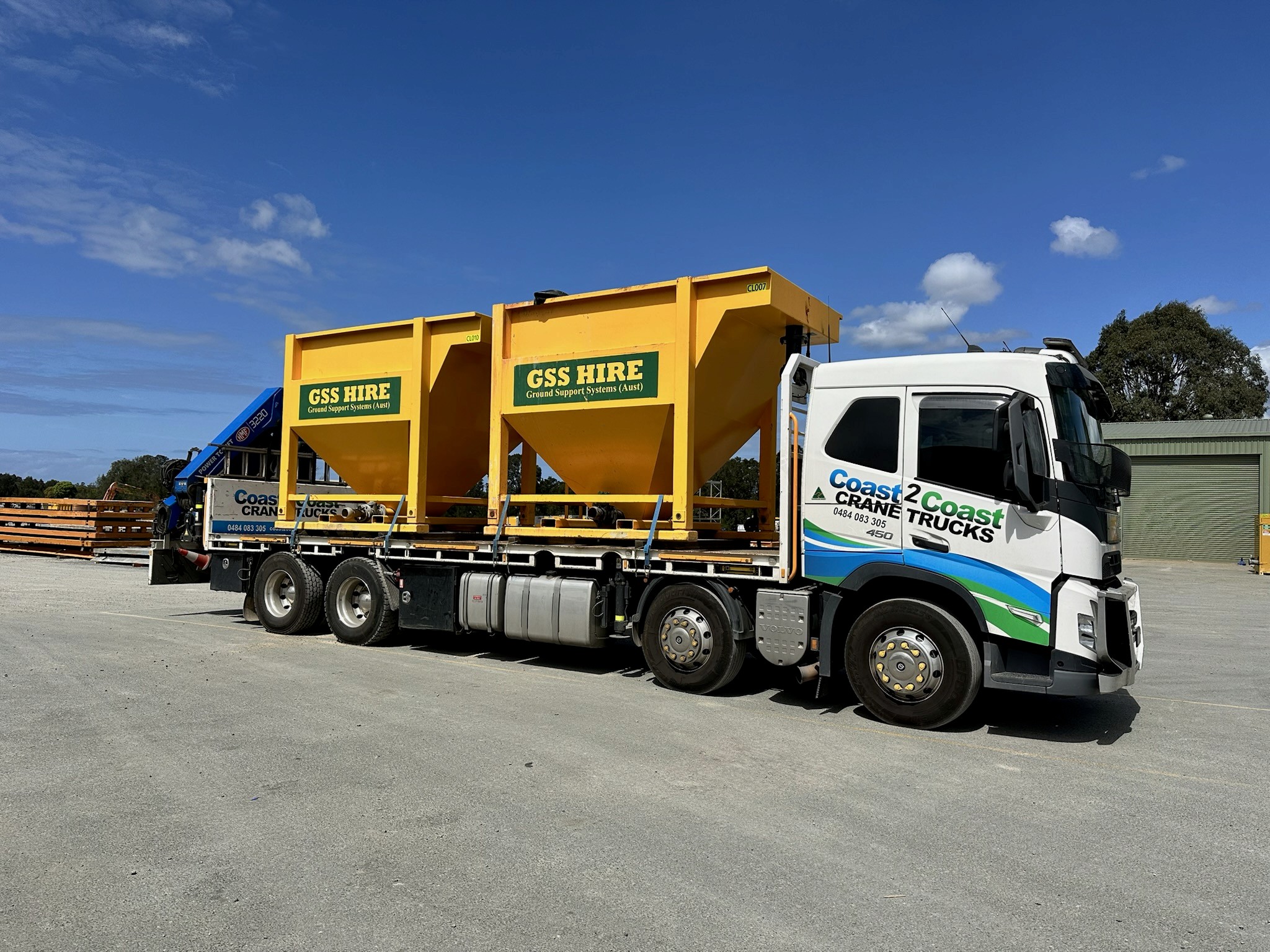 Hiab crane truck transporting treatment equipment