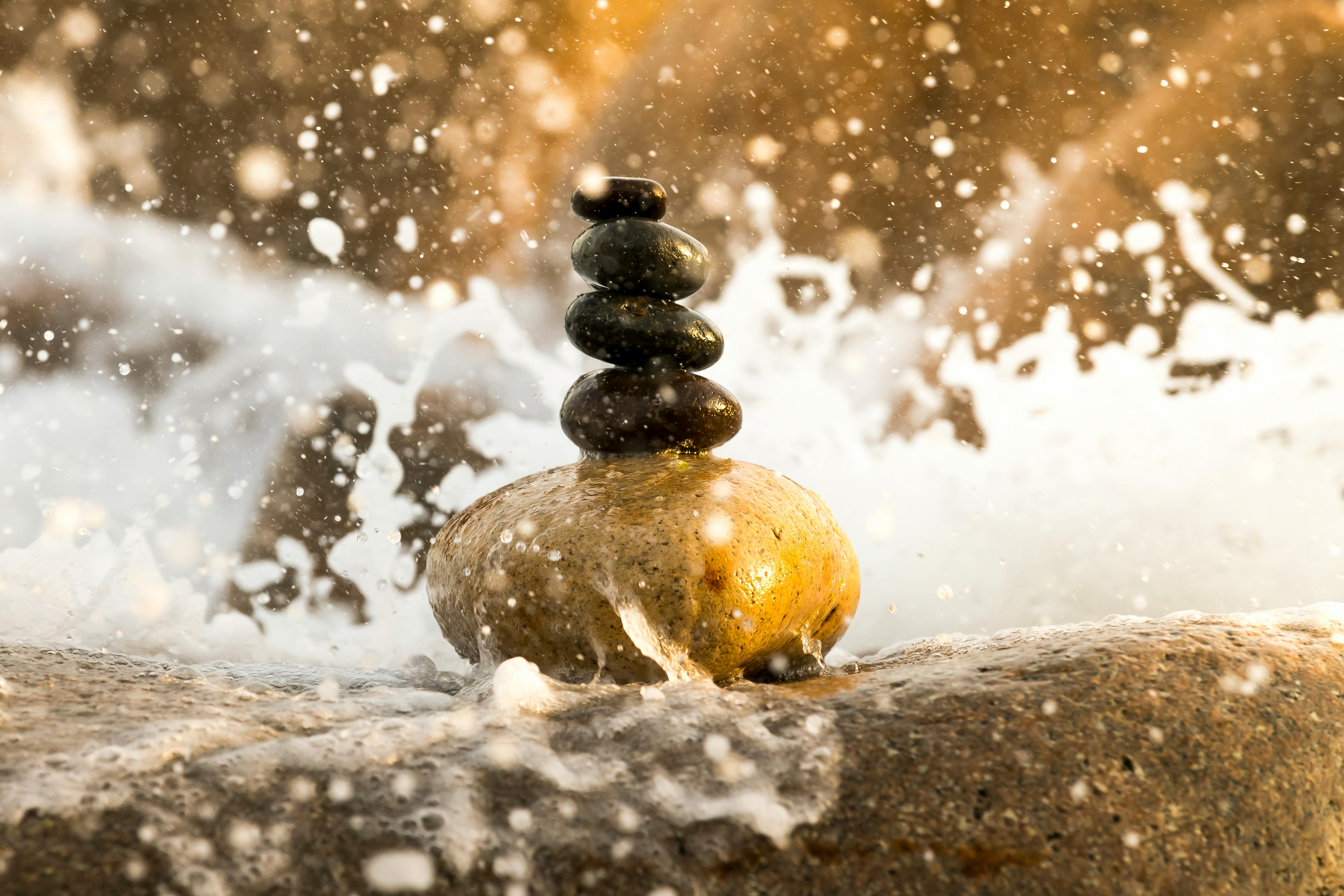 Meditation rocks splashed by waves