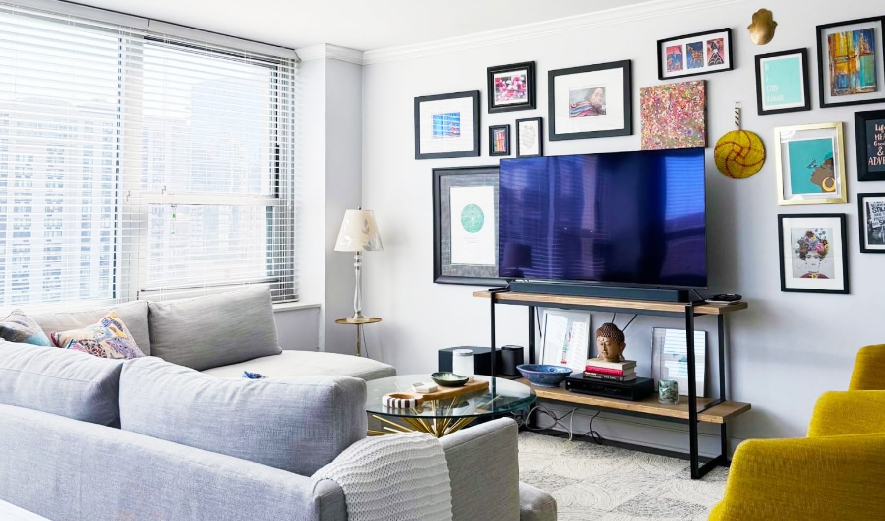 modern clean colorful living room with tv and gallery wall