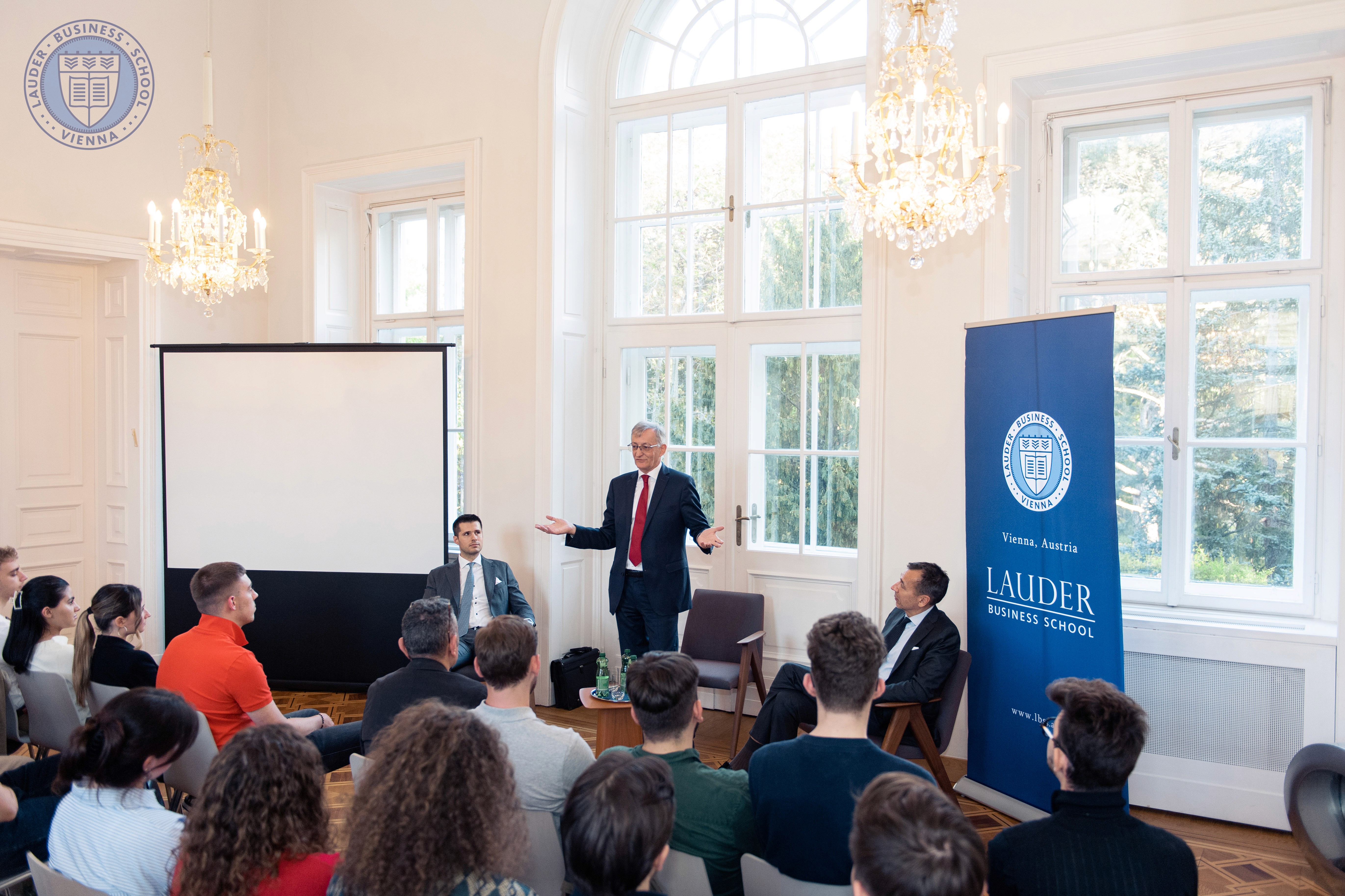 Johannes Koller, the Managing Director, Head of Investment Solutions & Services at Unicredit Bank Austria and Schoellerbank talking to LBS students