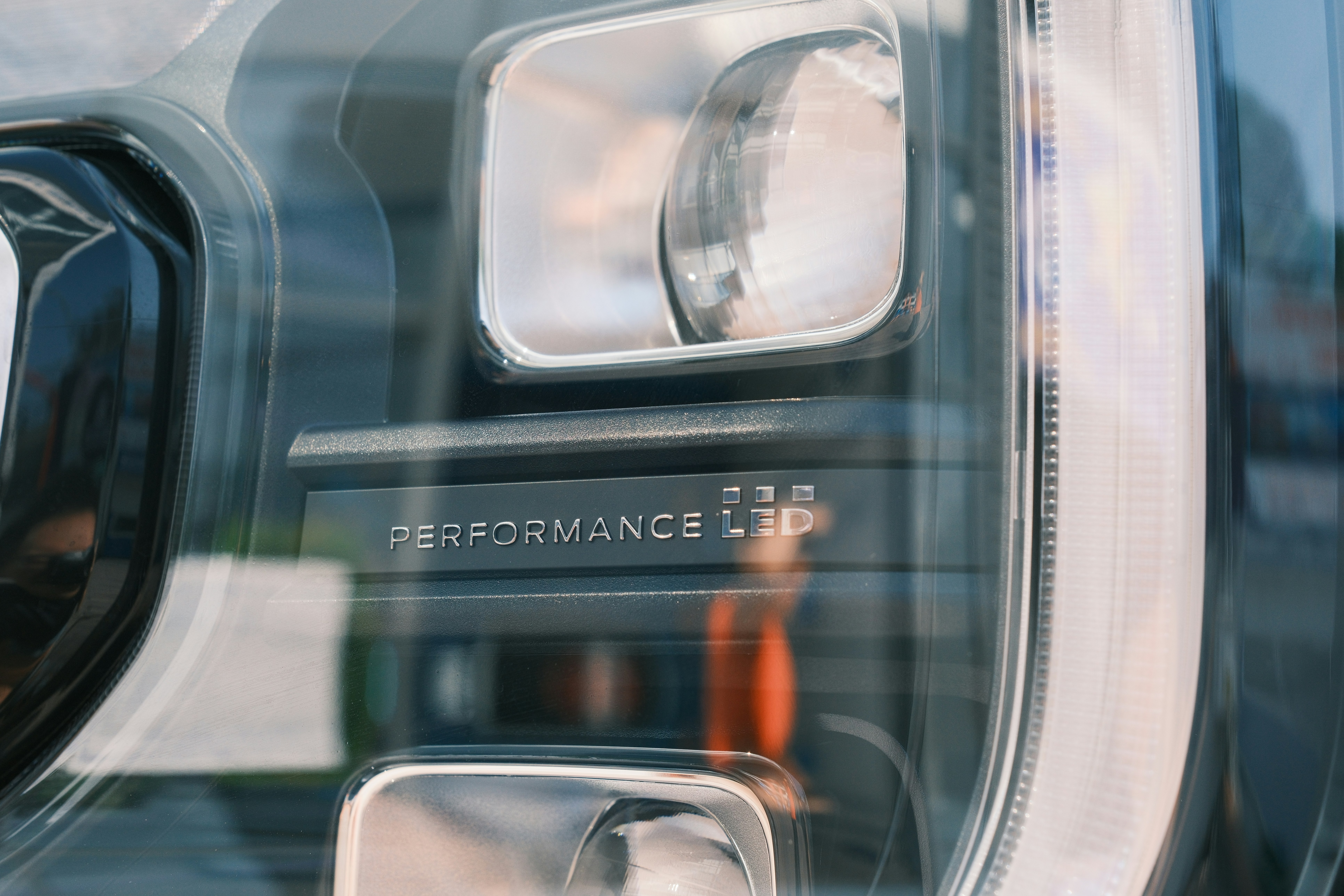 Close-up of a Land Rover Defender LED headlight assembly.