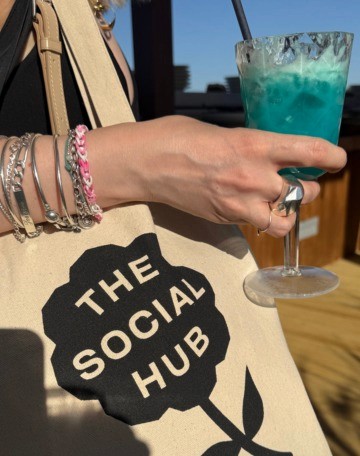 A stylish girl holding a laptop