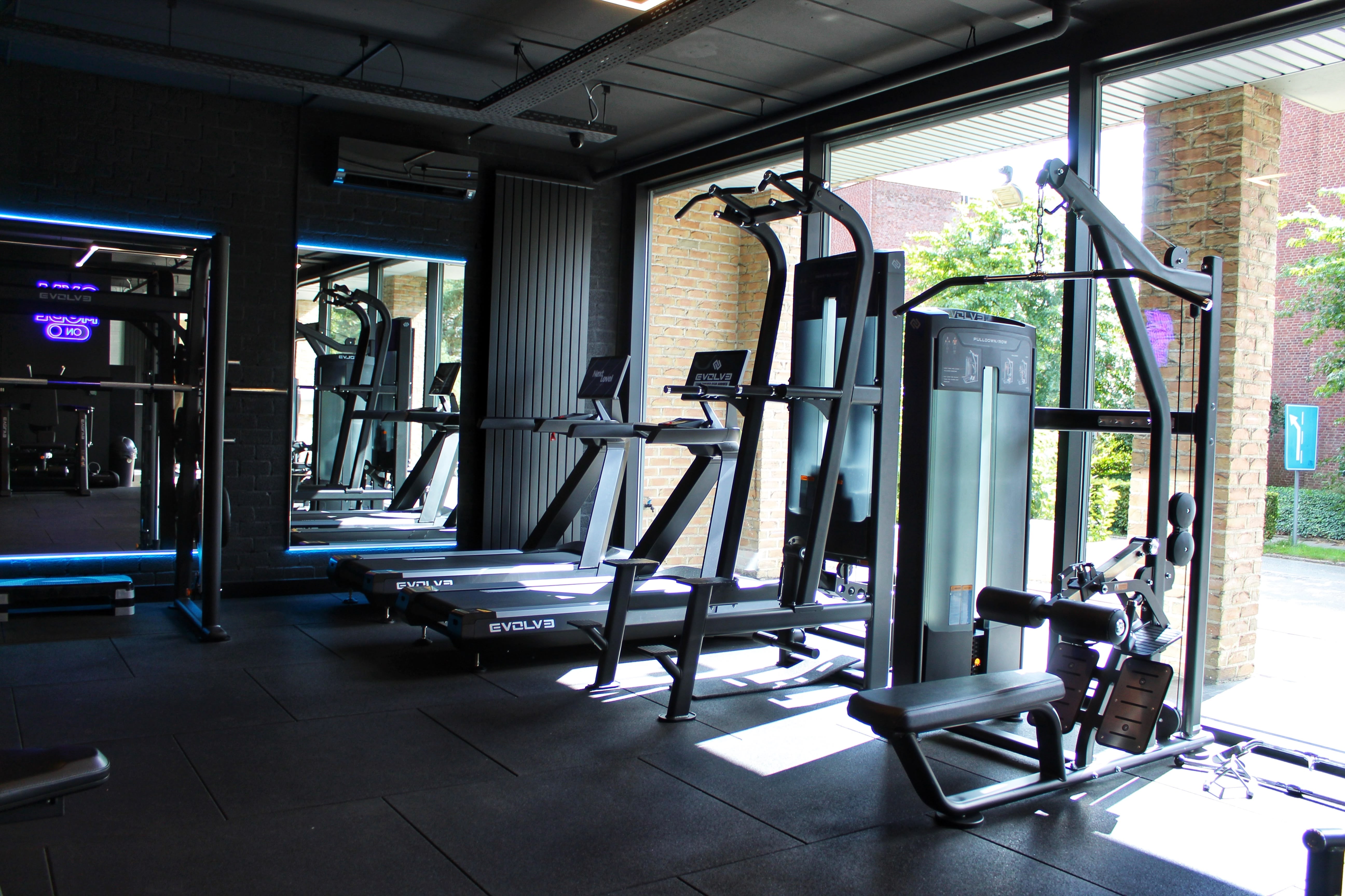 Full shot people training together at gym