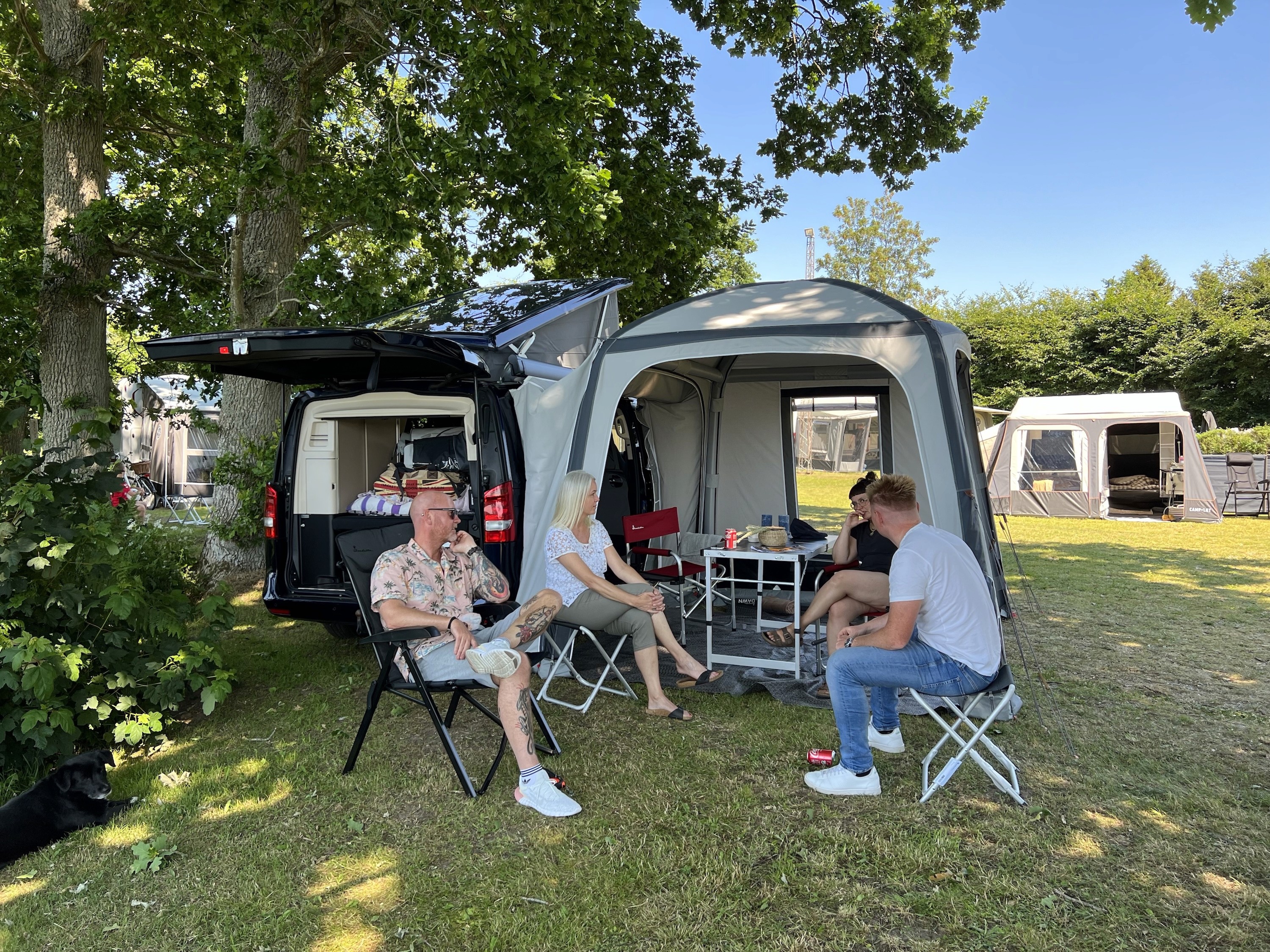 Campers hanging out with an Isabella X-Tension