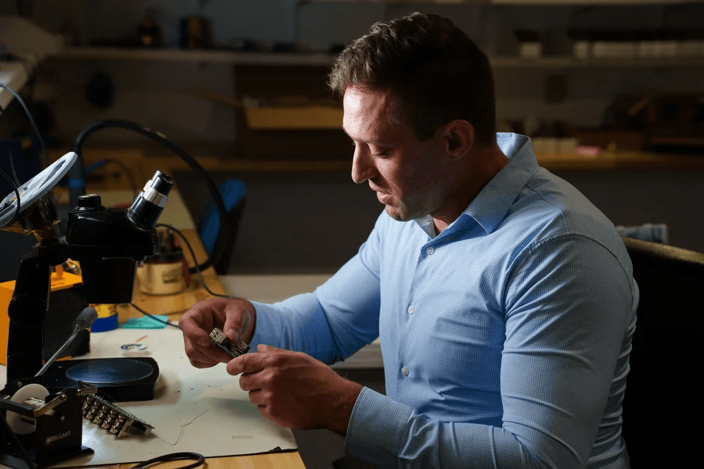 Technician working with electronic components.