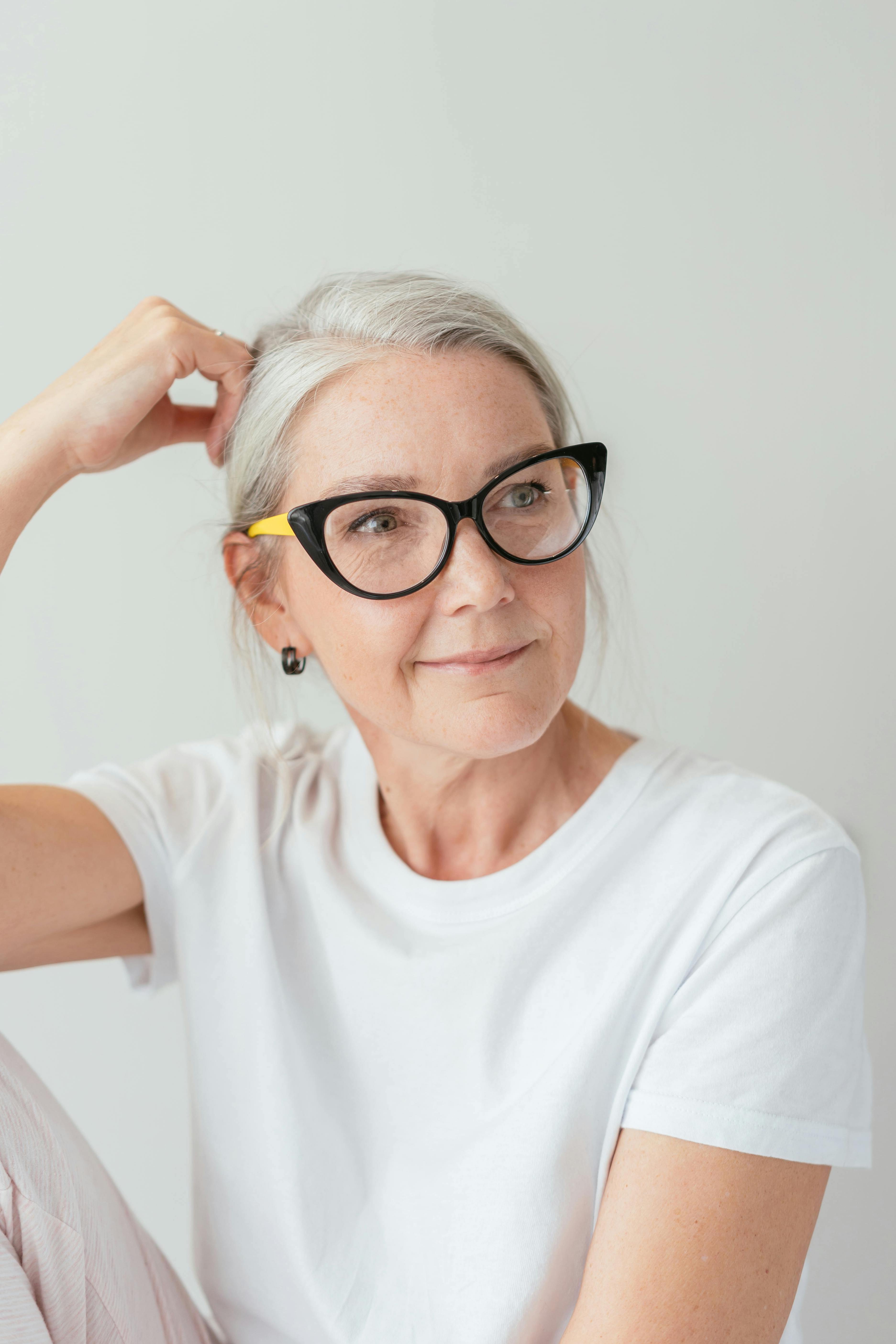 Close-up of a dark green leaf showing its textured surface and central vein against a muted background.