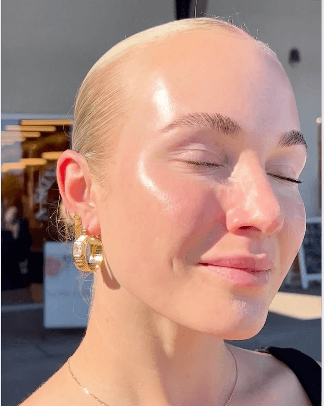 Woman with glowy skin after getting a facial