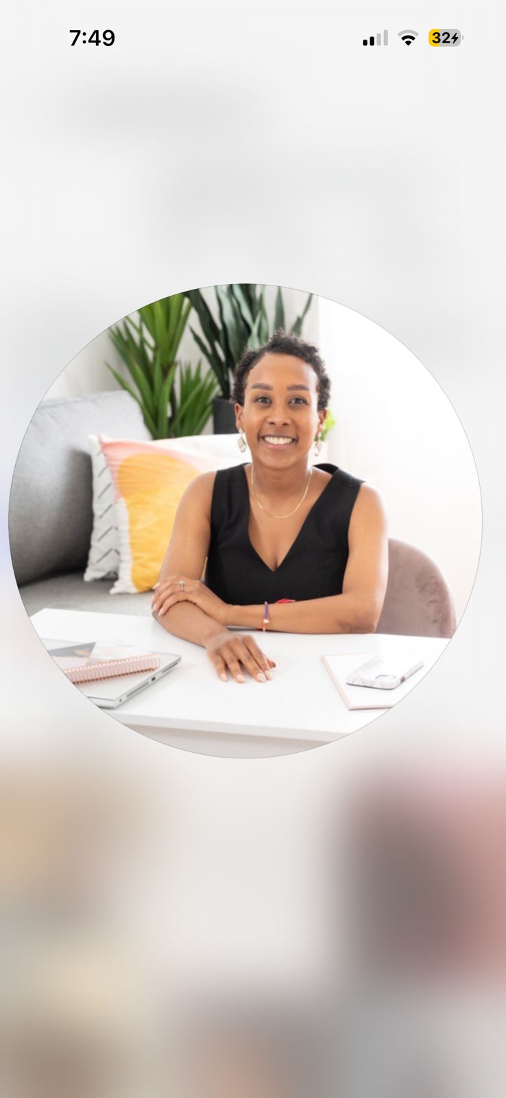 A person in a blue coat smiling