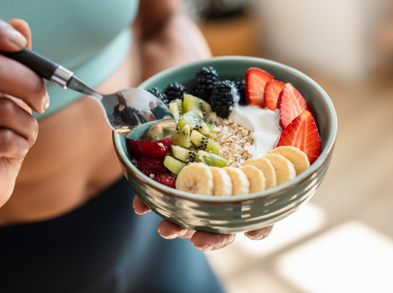 woman eating a healthy breakfast for fueling weight loss stair climbing before and after