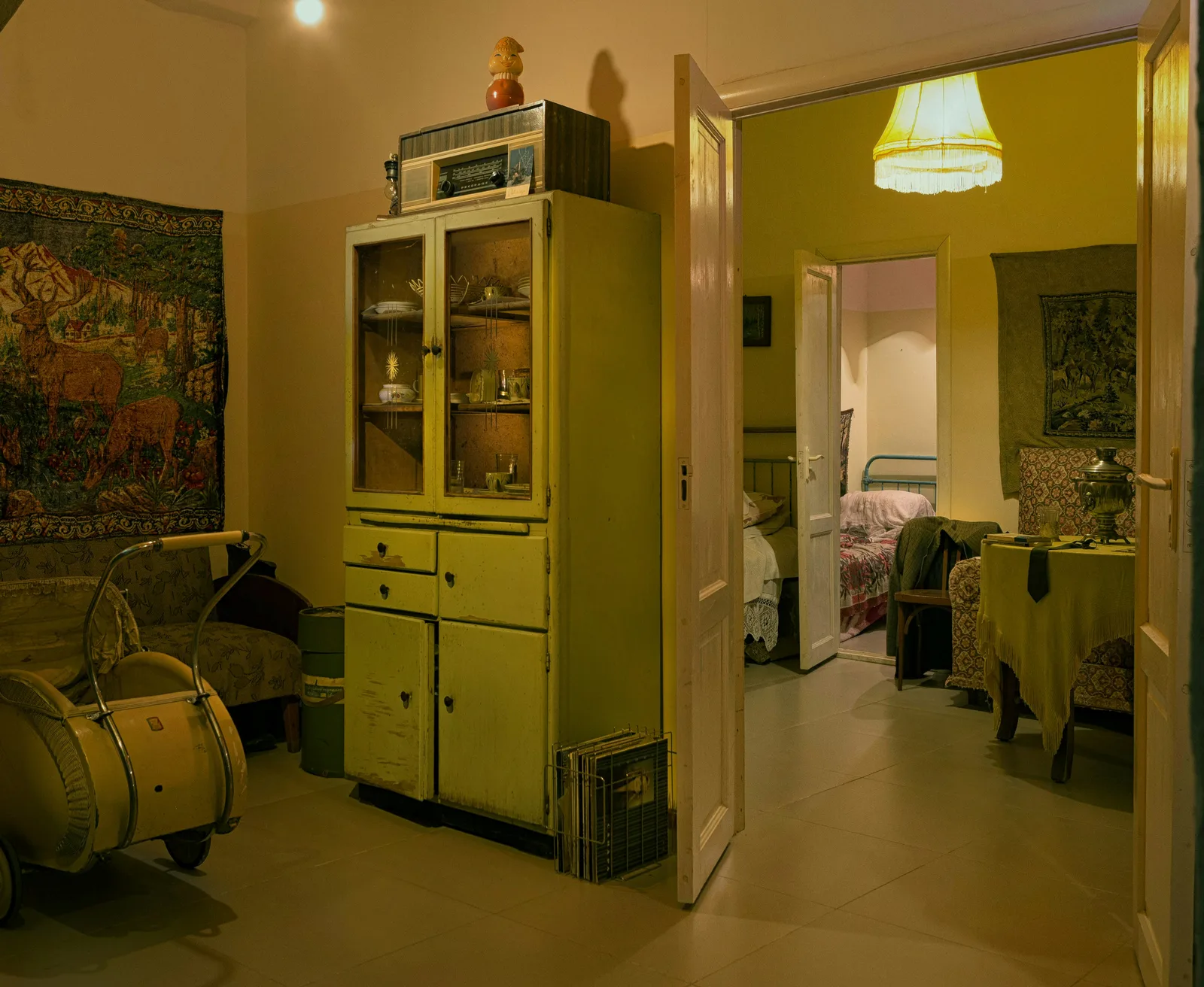 Interior of vintage apartment with old furniture and yellowed lighting