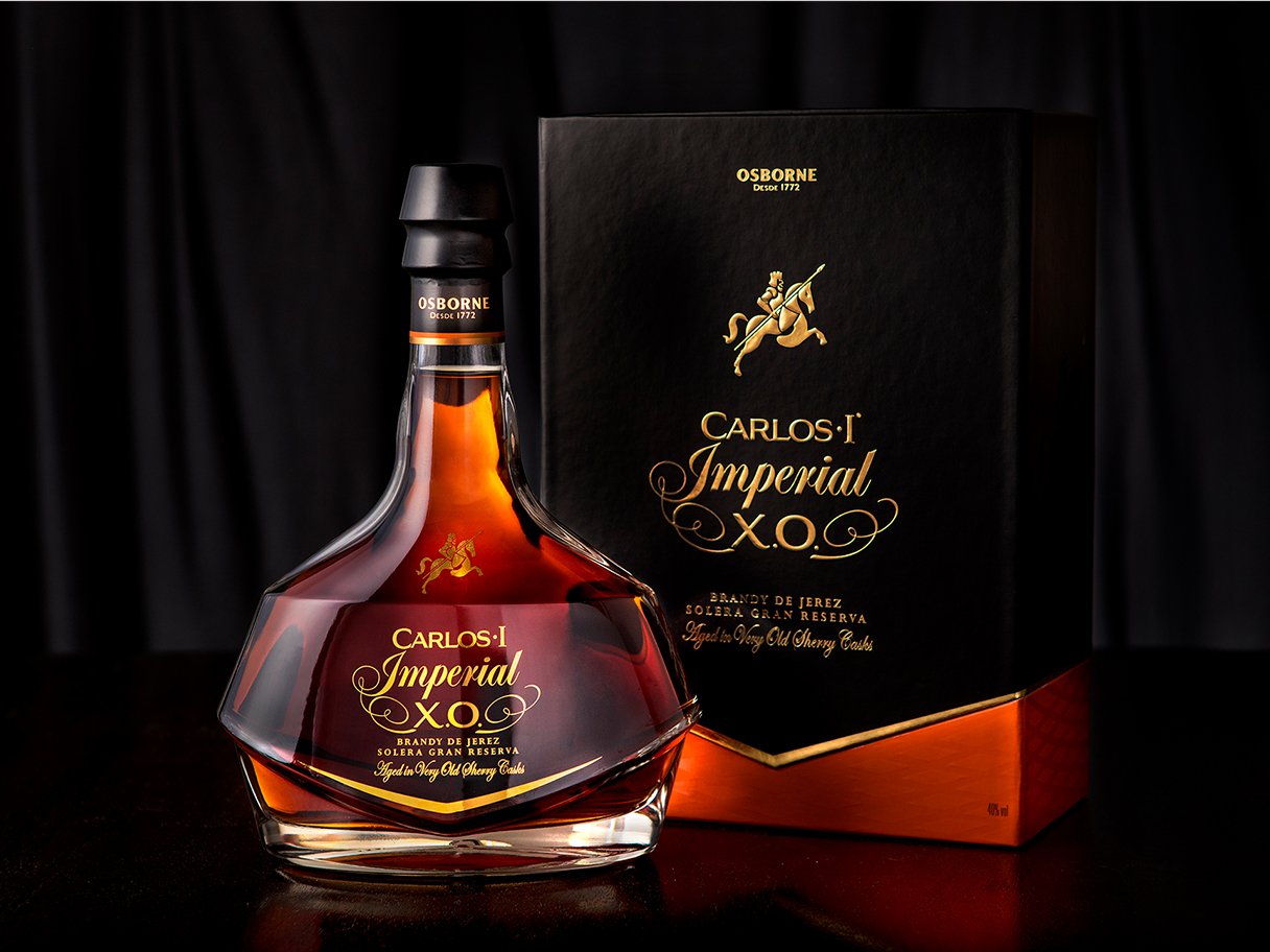 Rooftops of a coastal town with the sea in background