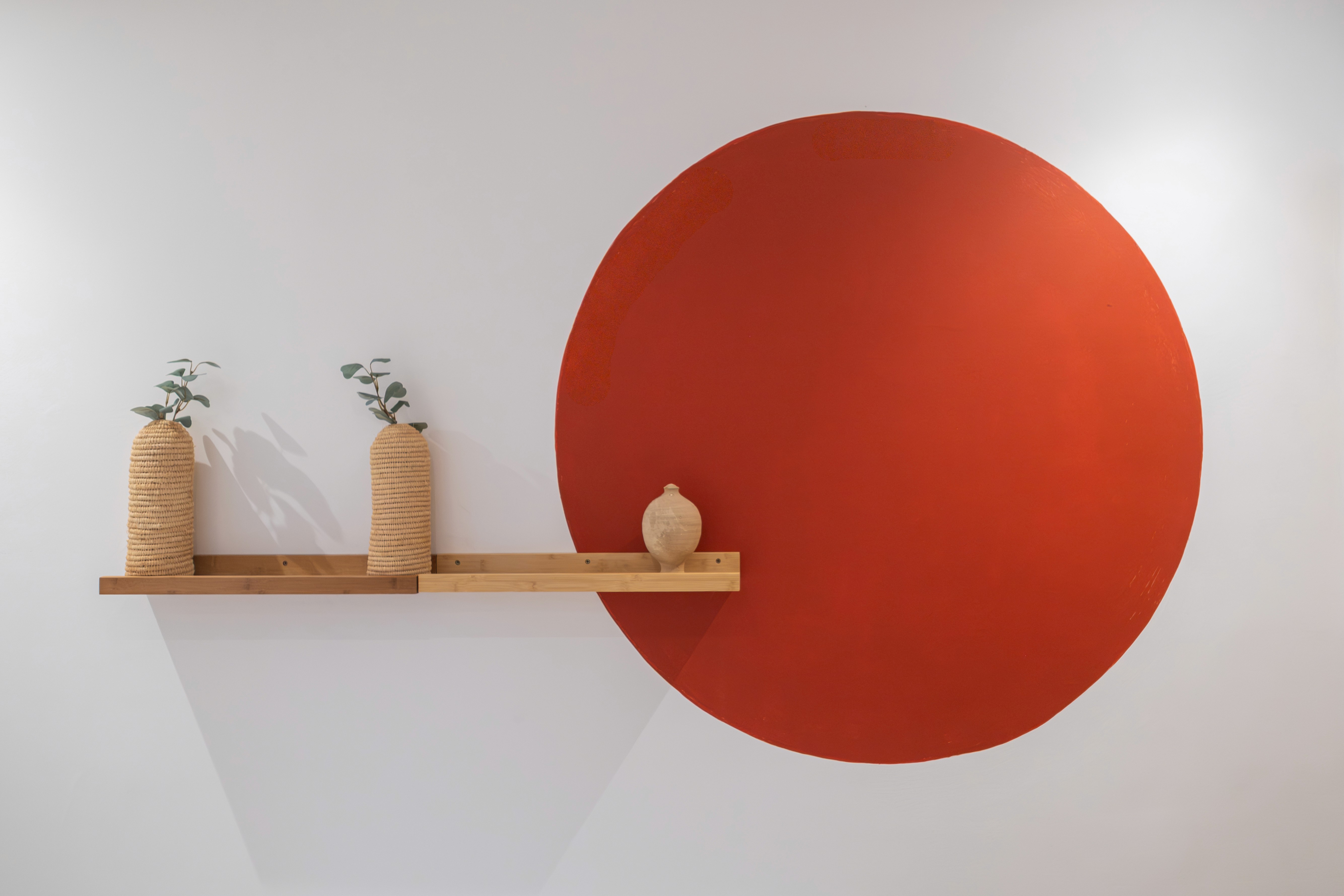 A man stading with Surfboard