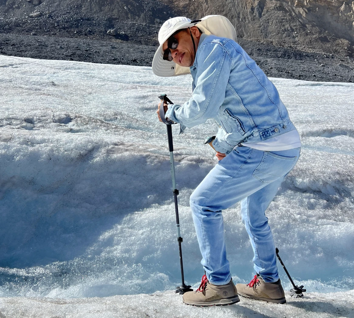 A photo of the author wearing a very functional hat (blocks sun on back side and light/cool) that they previously viewed as stereotypically FOB-y