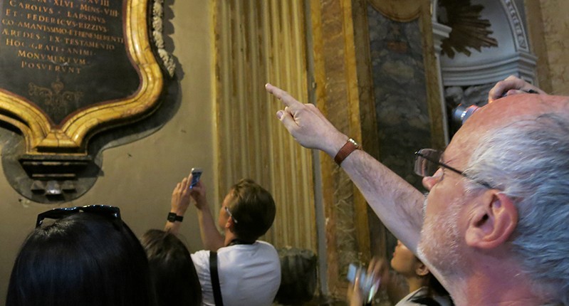 Person pointing to old letters