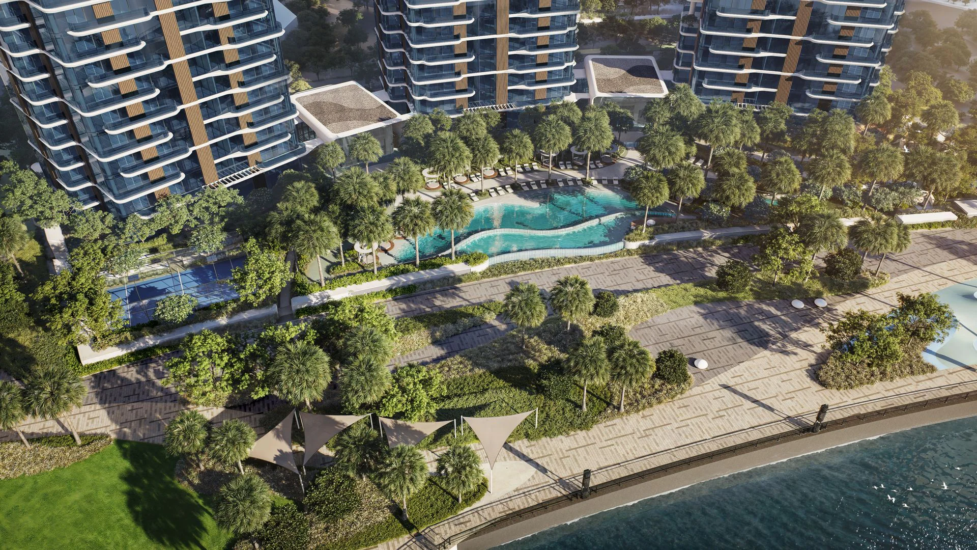Beachfront apartments overlooking the bay, featuring modern architecture and scenic views of the water and shoreline.