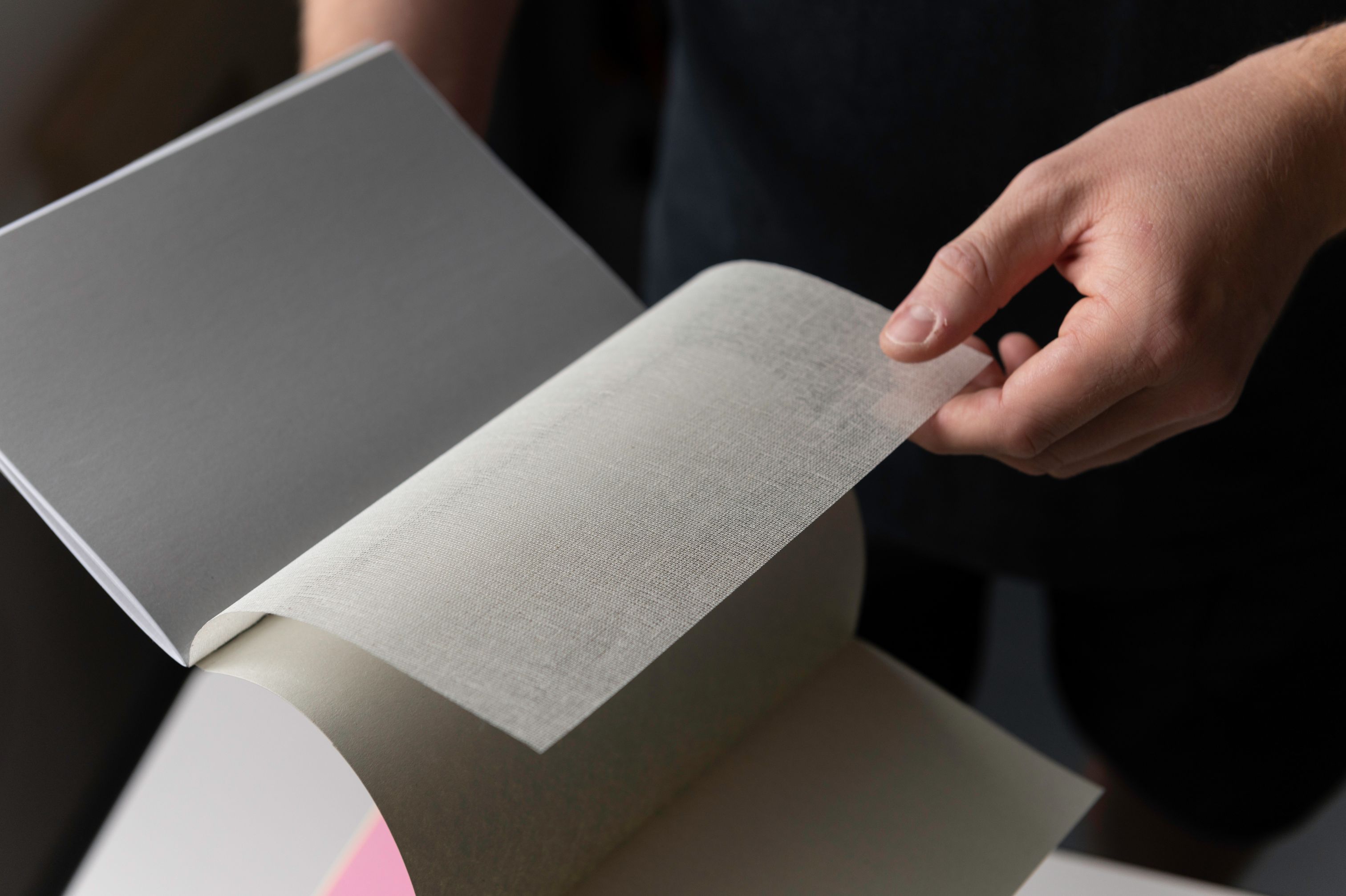 Adam showing a bookbinding technique