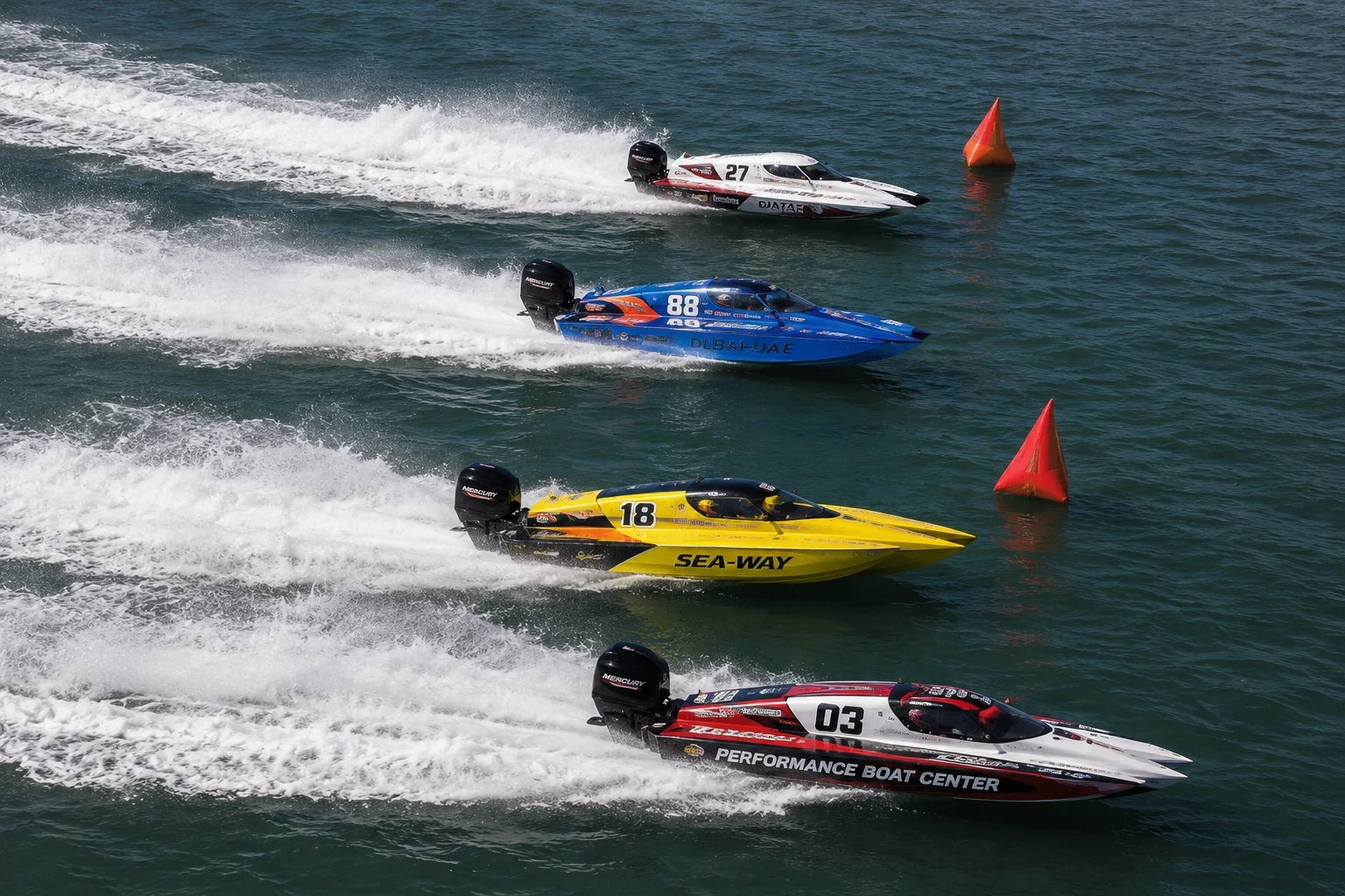 Aerial photograph of 4 speed boats on water