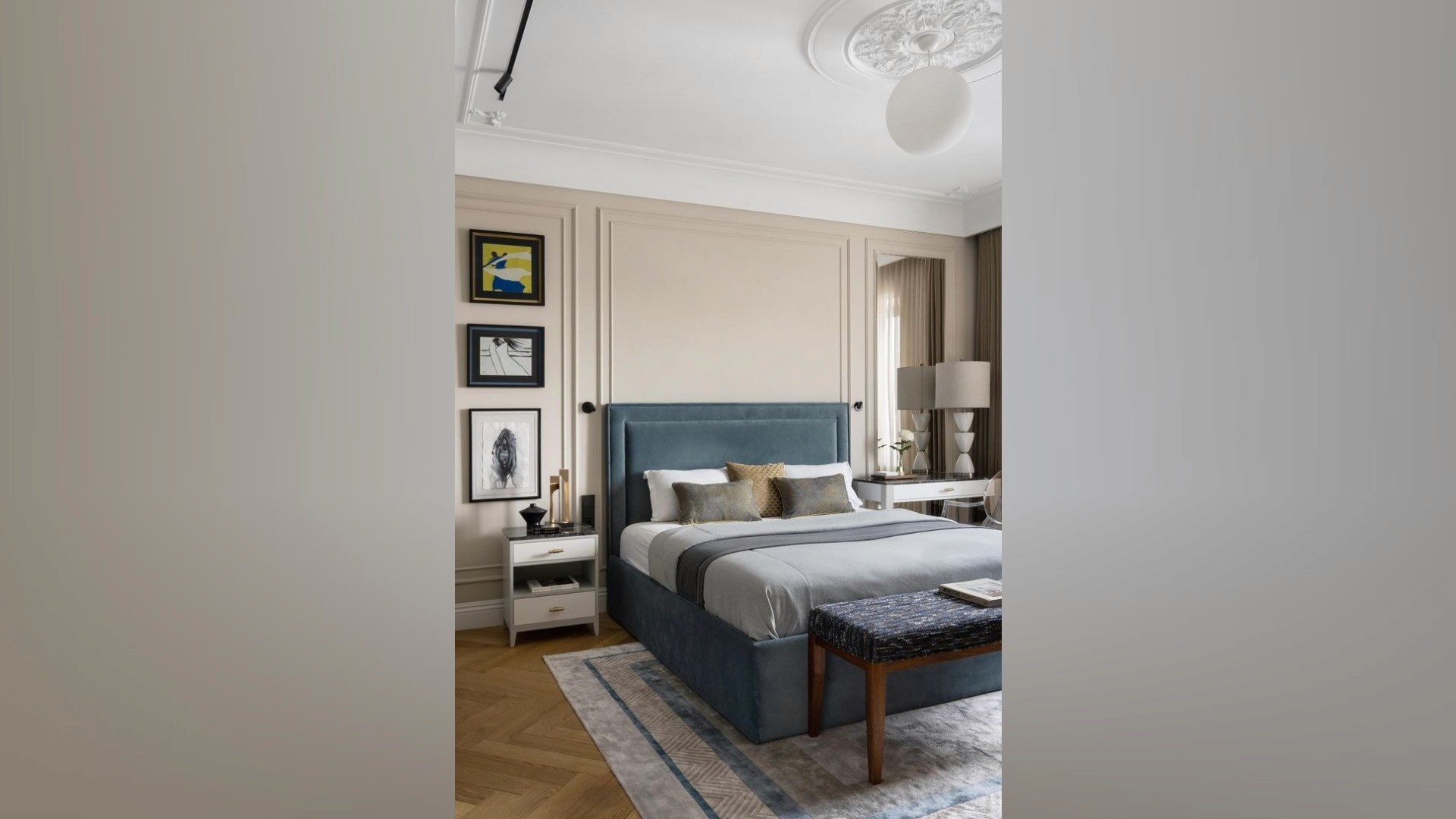 Art-filled walls and a built-in window desk complement the tailored upholstery in this Mount Pavilia home, prioritizing functional storage and mental clarity.
