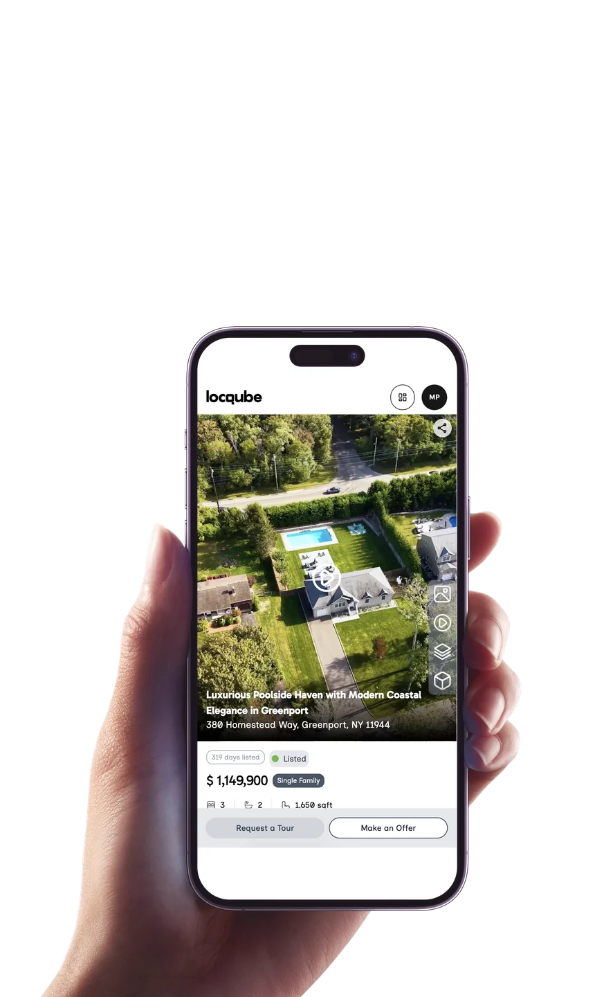A hand holding a phone showing a locqube listing