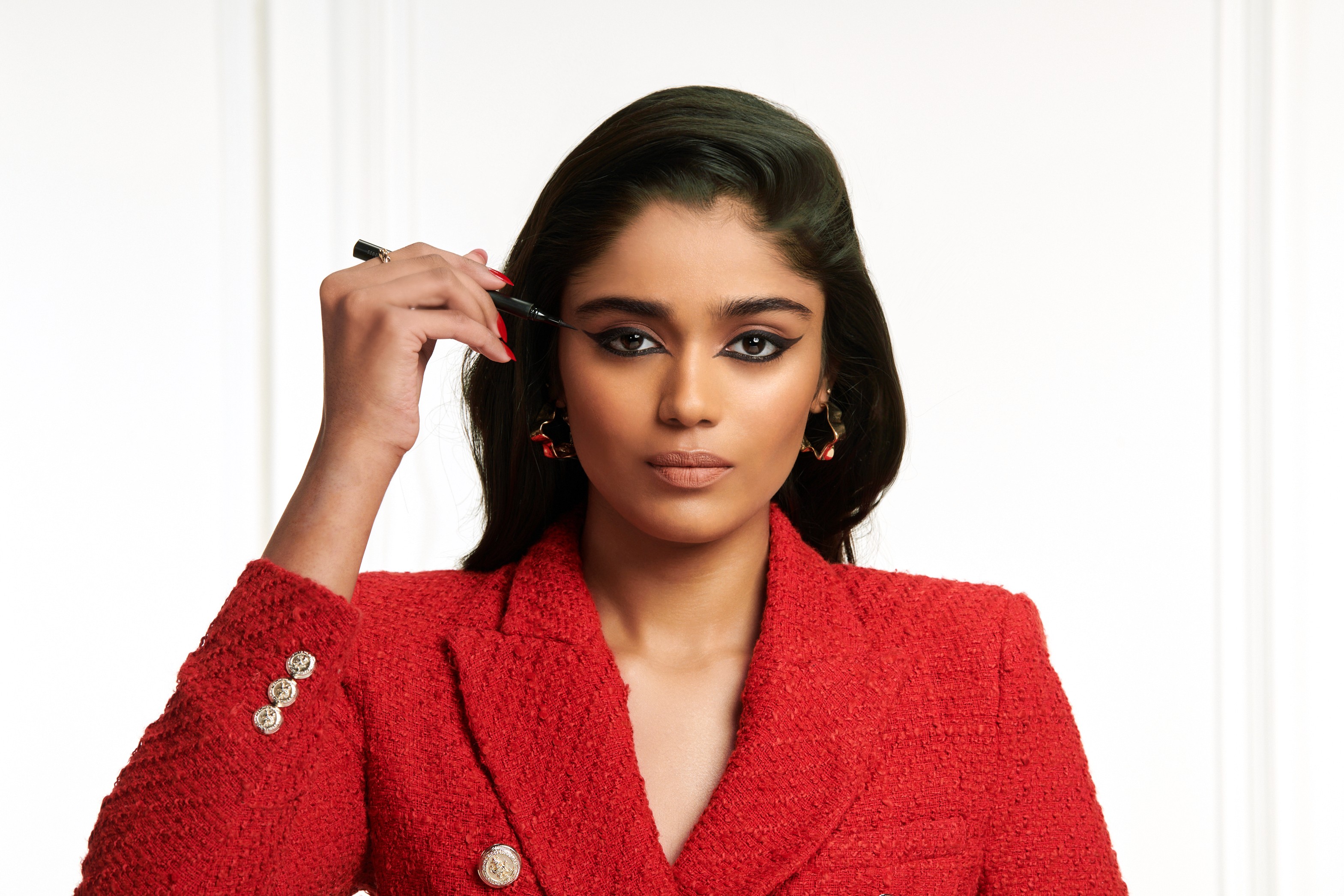 Group of friends smiling on a lively city street at night
