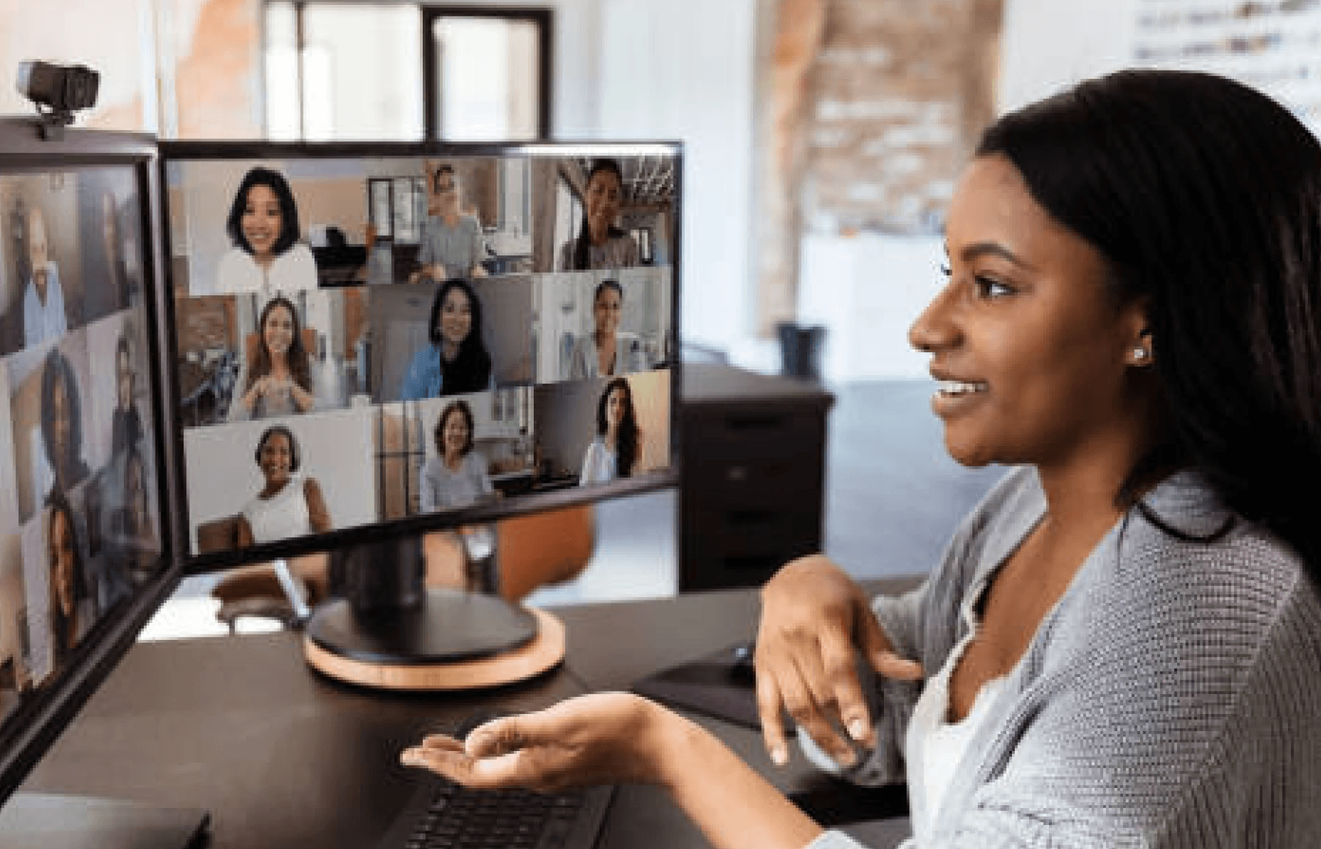 A lady speaking to other members of a virtual meeting