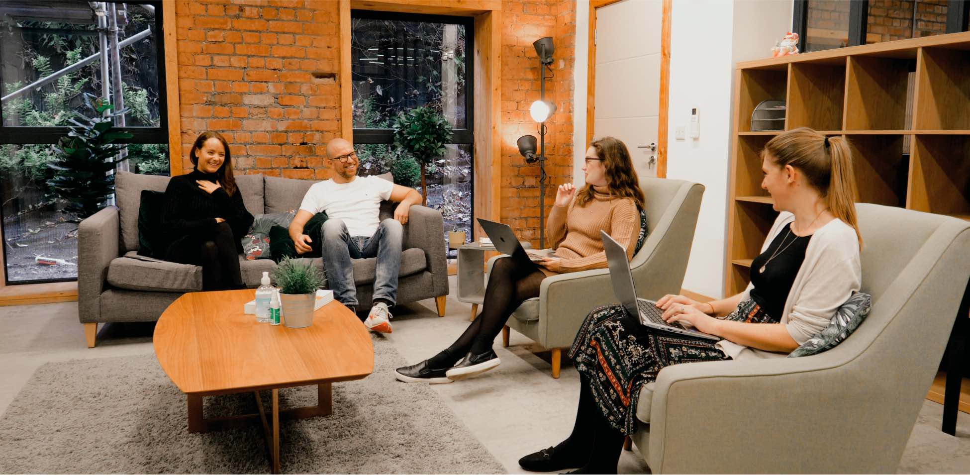 People sitting and talking in a cozy room.