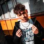 man in black crew neck shirt smiling