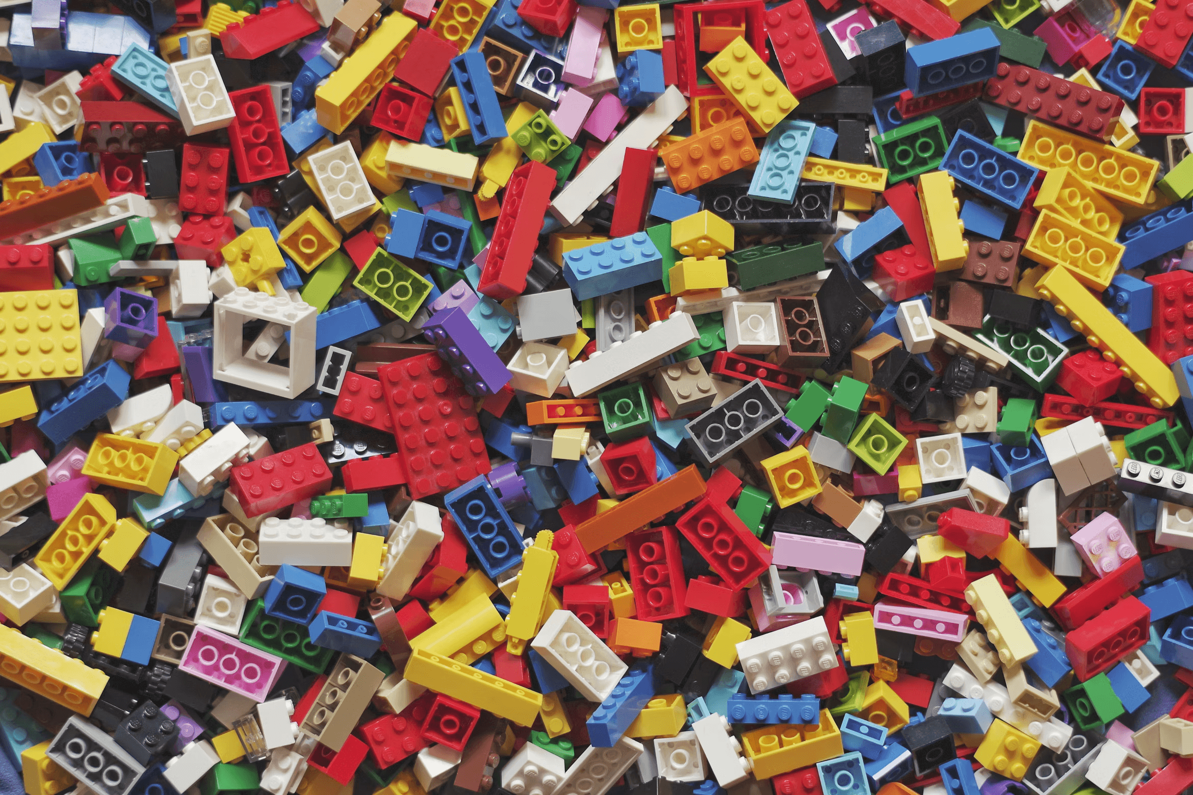 A pile of Lego bricks, of various sizes and colours