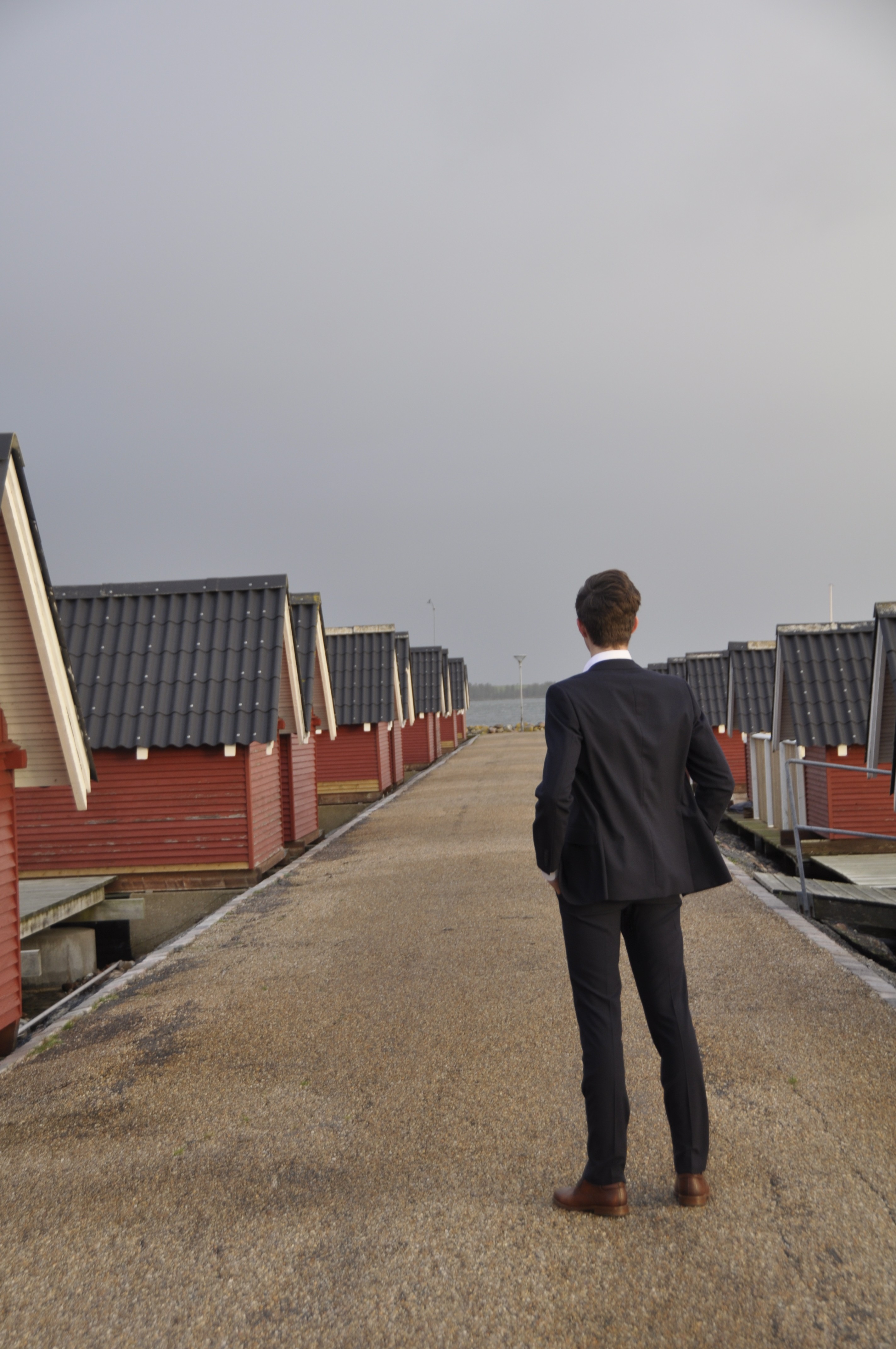 An asian person in a dark area with a sunlight on him