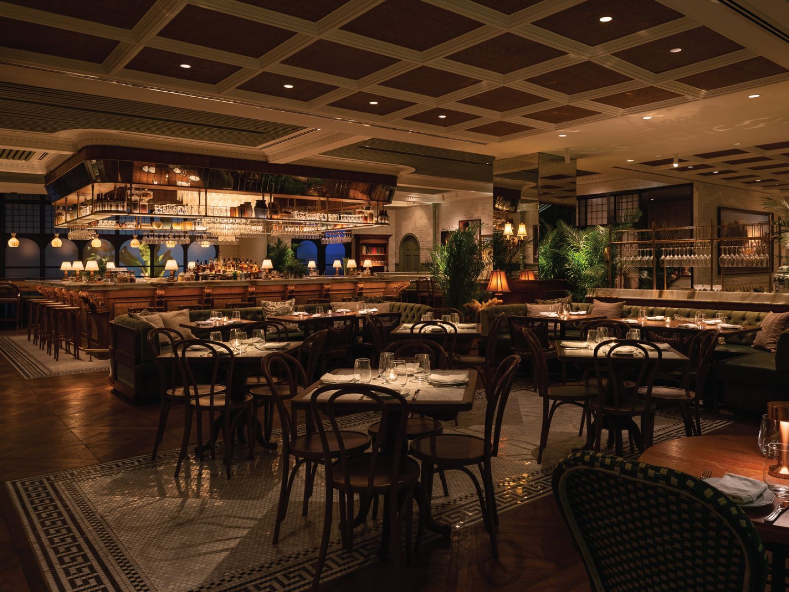 Elegant restaurant dining room with bar and tables.