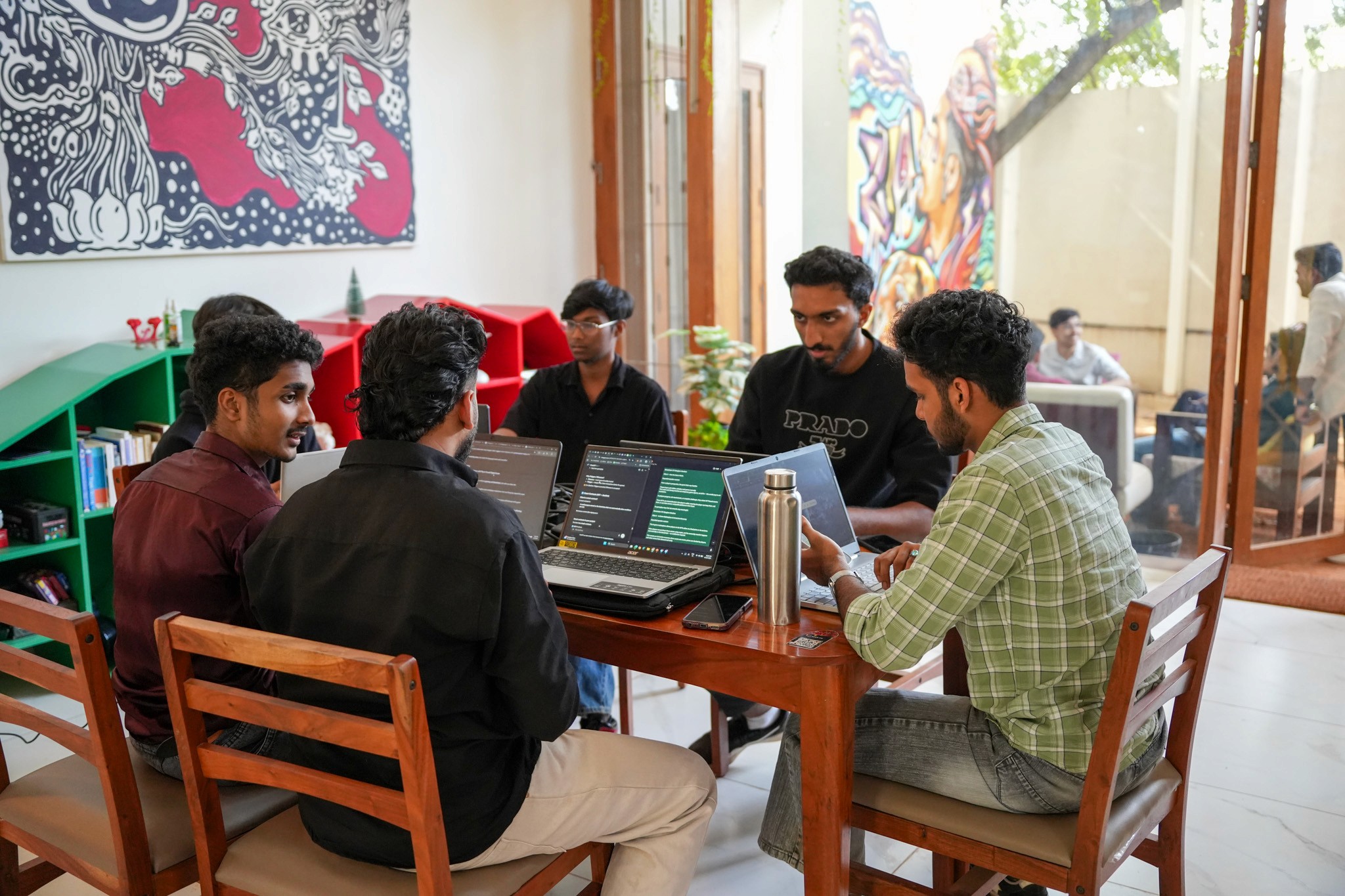 Developers collaborating during blockchain hackathon