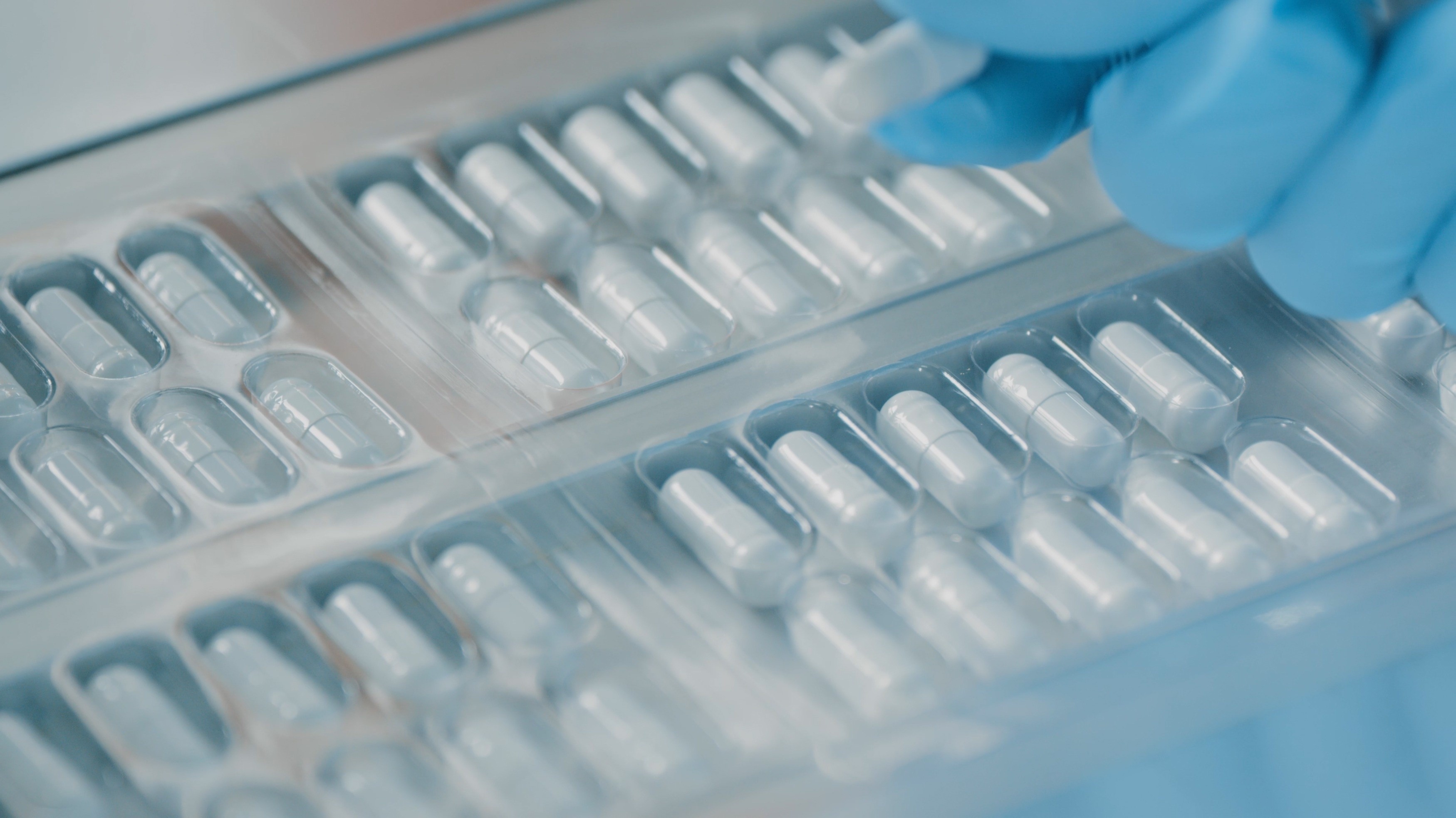 Medicine capsules in capsule packaging.