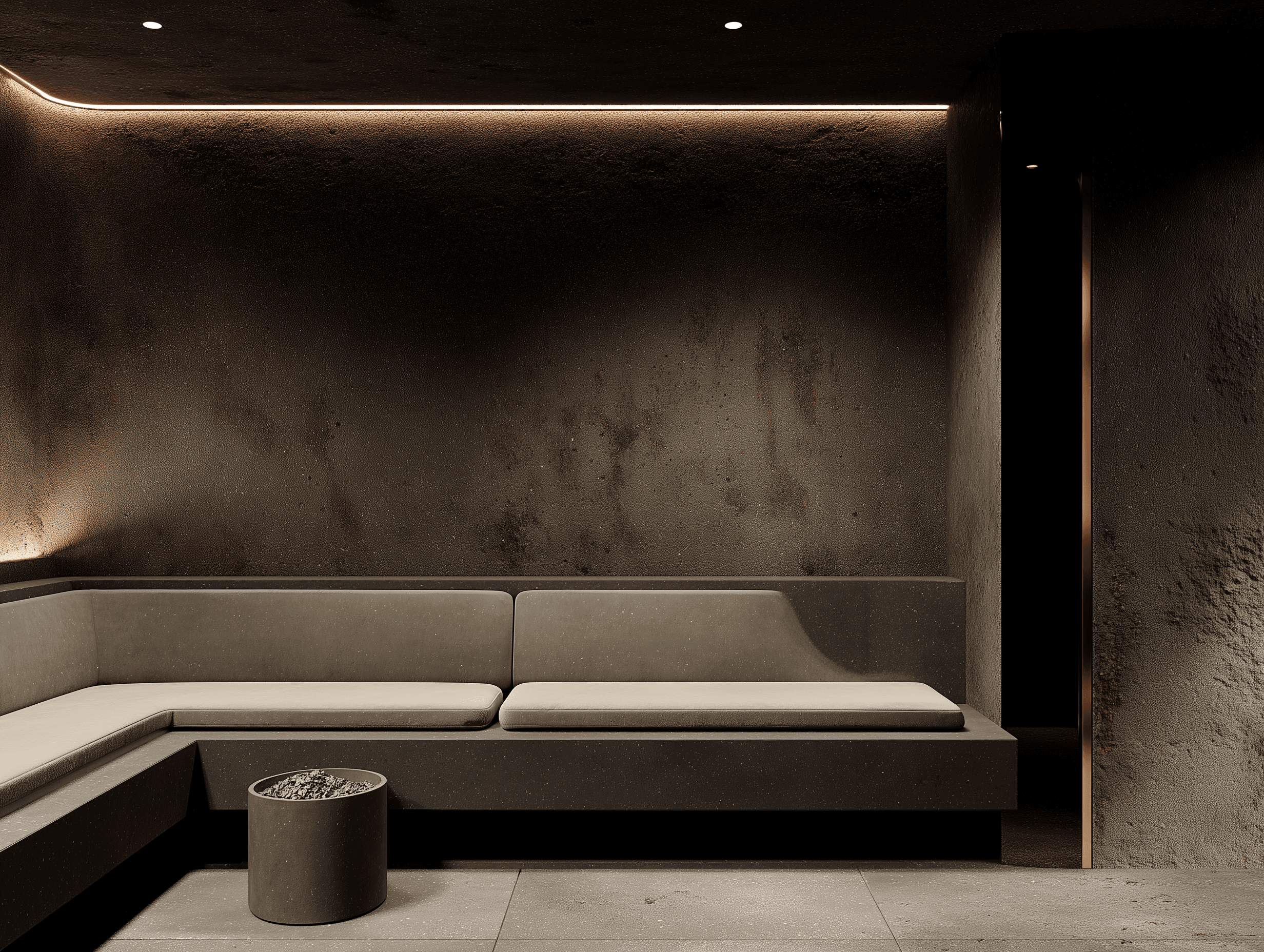 A dimly lit, minimalist lounge area with a concrete L-shaped bench and a glowing light strip along the textured wall.