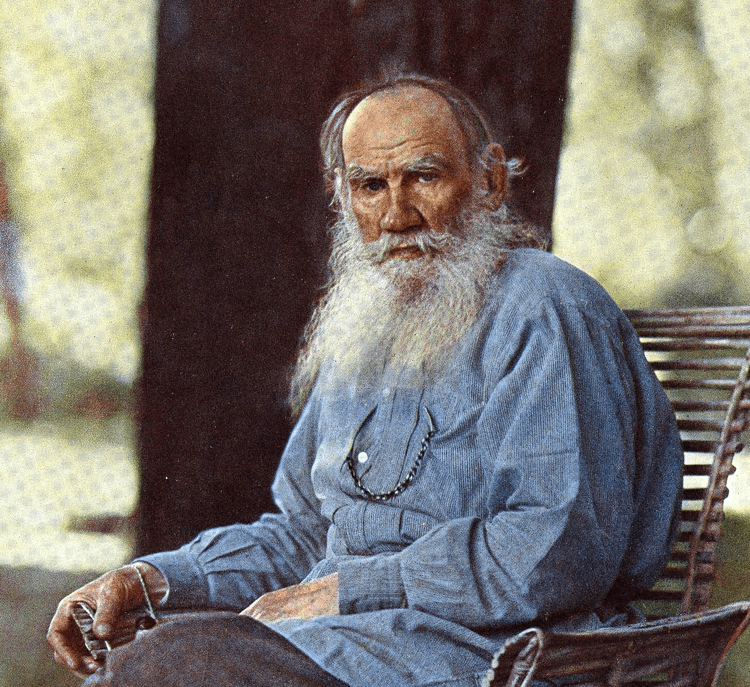 woman in black button up shirt holding black and white book