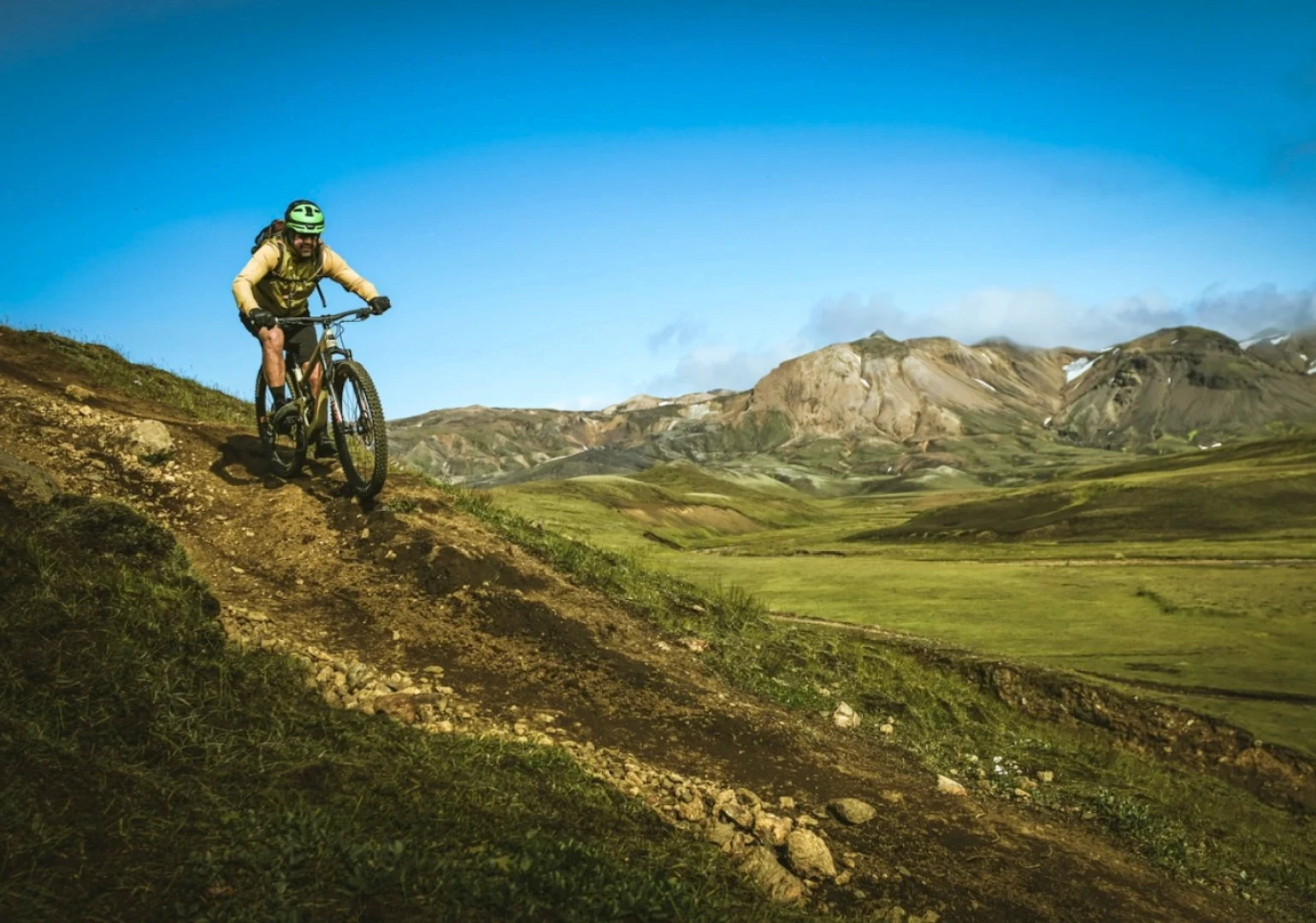 one man rides down singletrack in iceland on a bronson bike