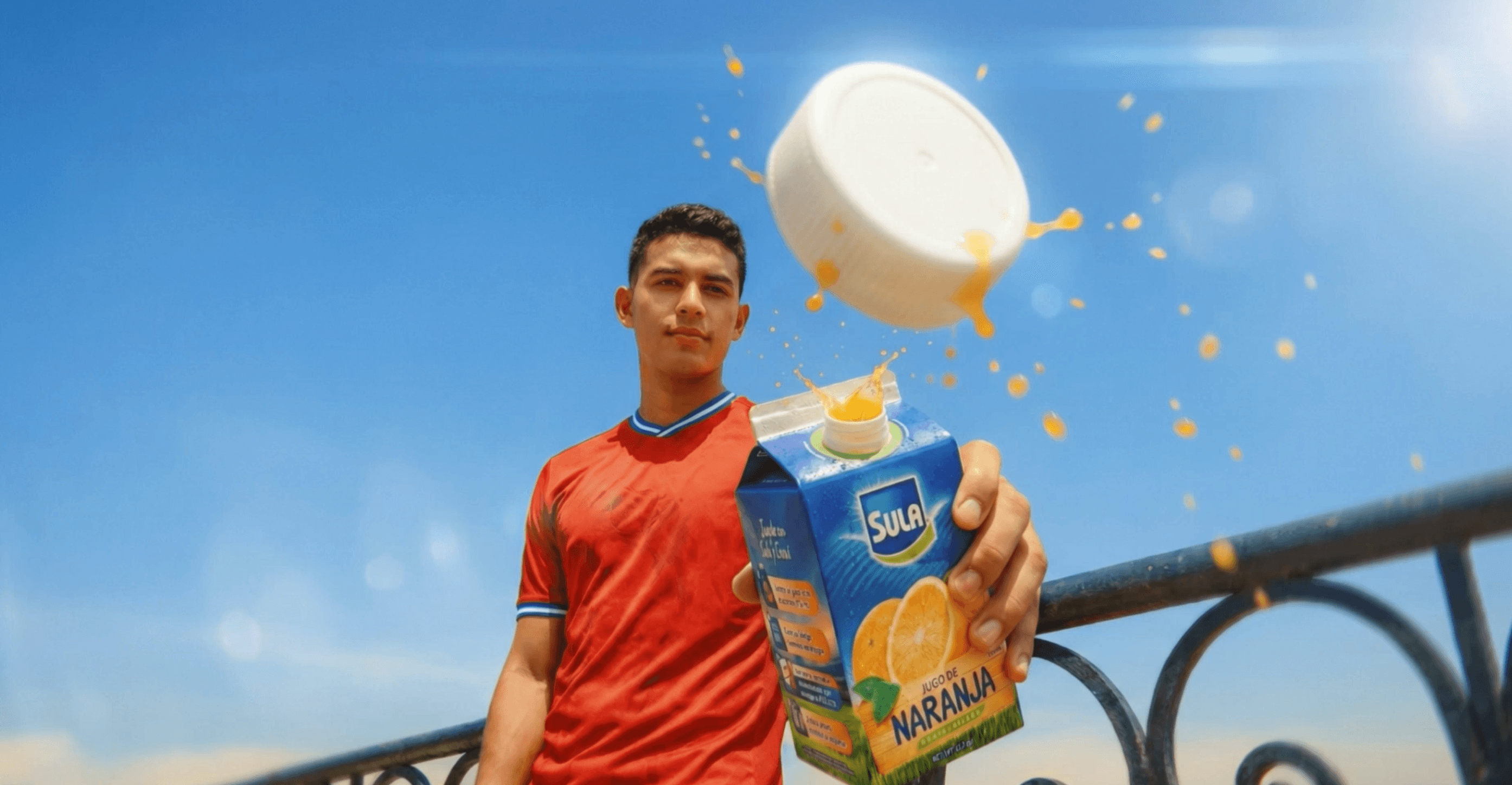 A silhouette of a person wearing sunglasses, with tousled hair, against a teal background.