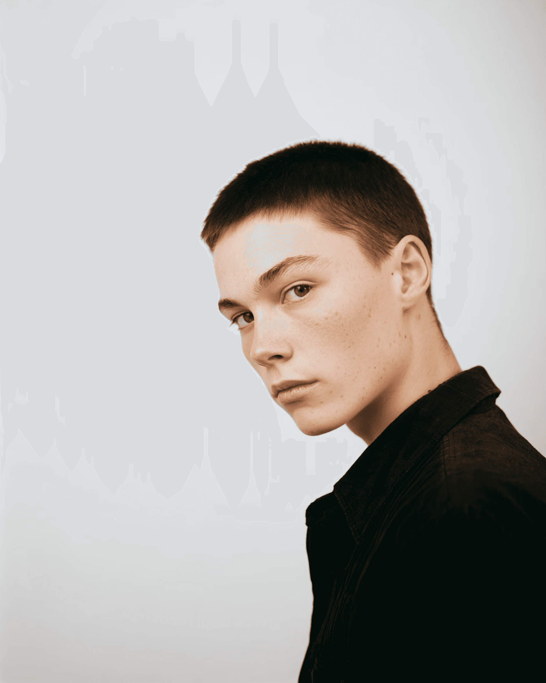 Minimalist Portrait of a man in a black shirt.