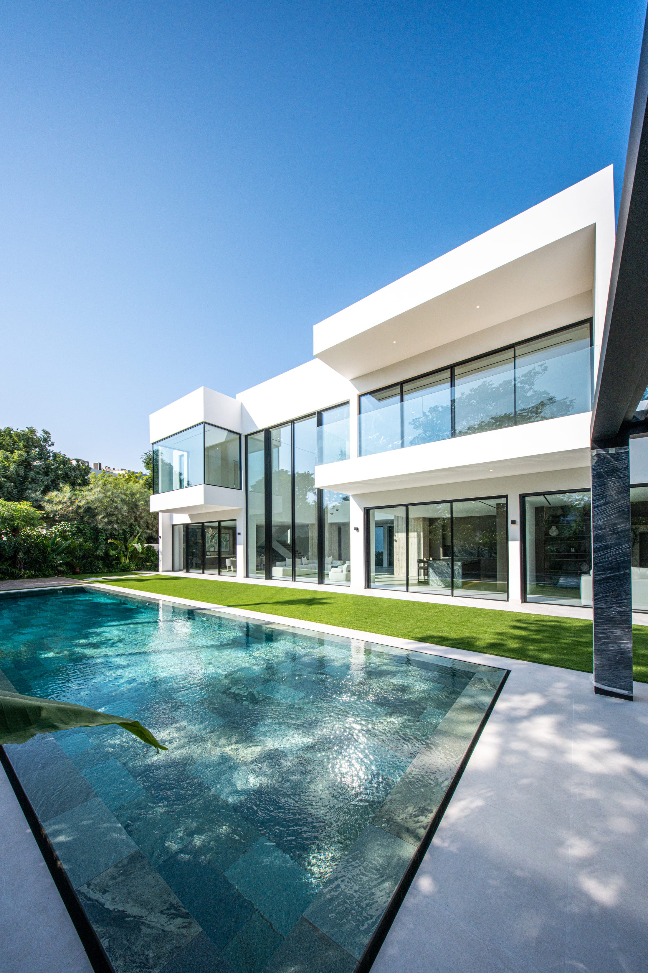 Image of a large villa with big glass windows