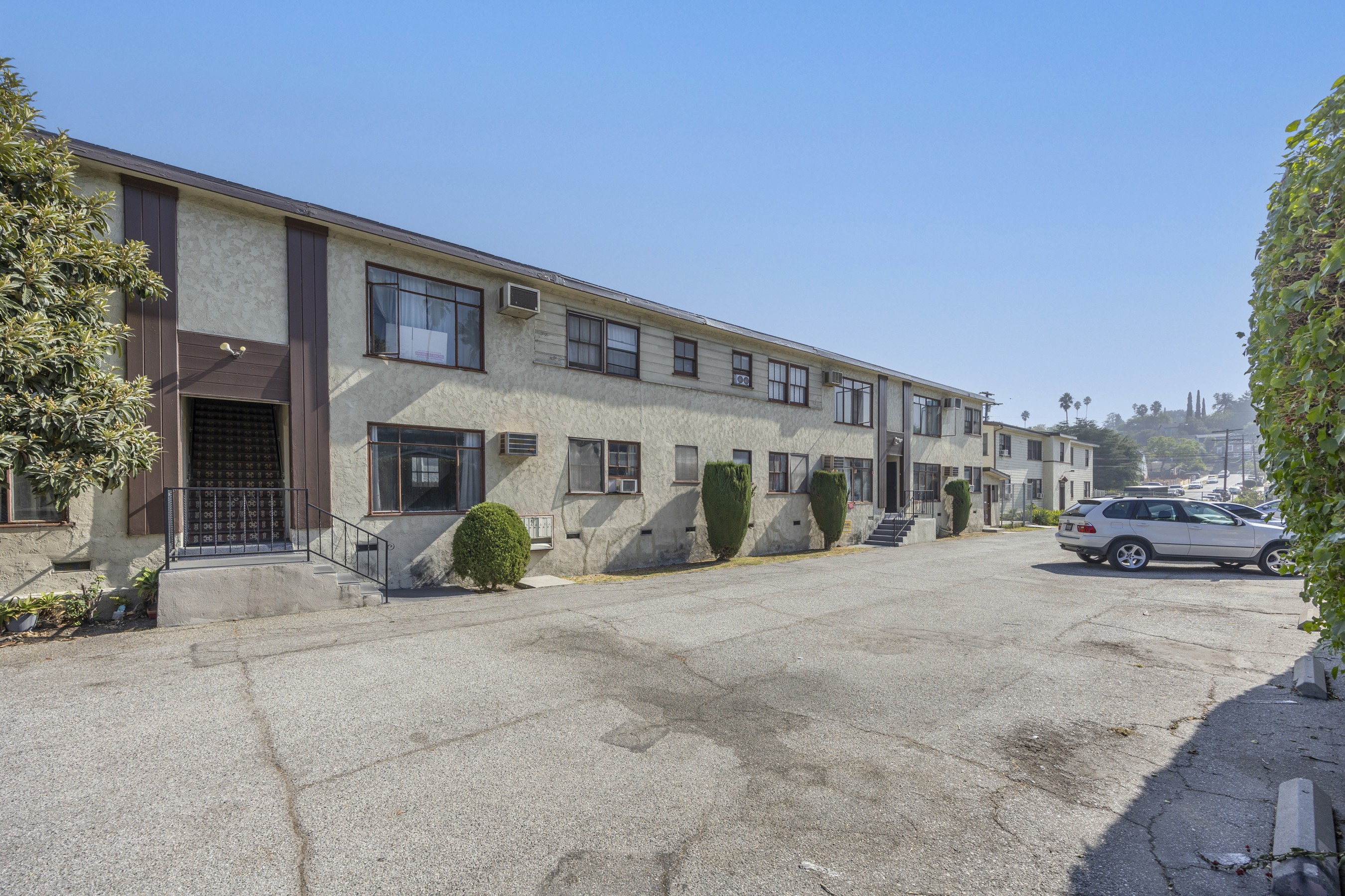 Broad exterior view of the apartment complex highlighting parking and building layout at 4650 york.
