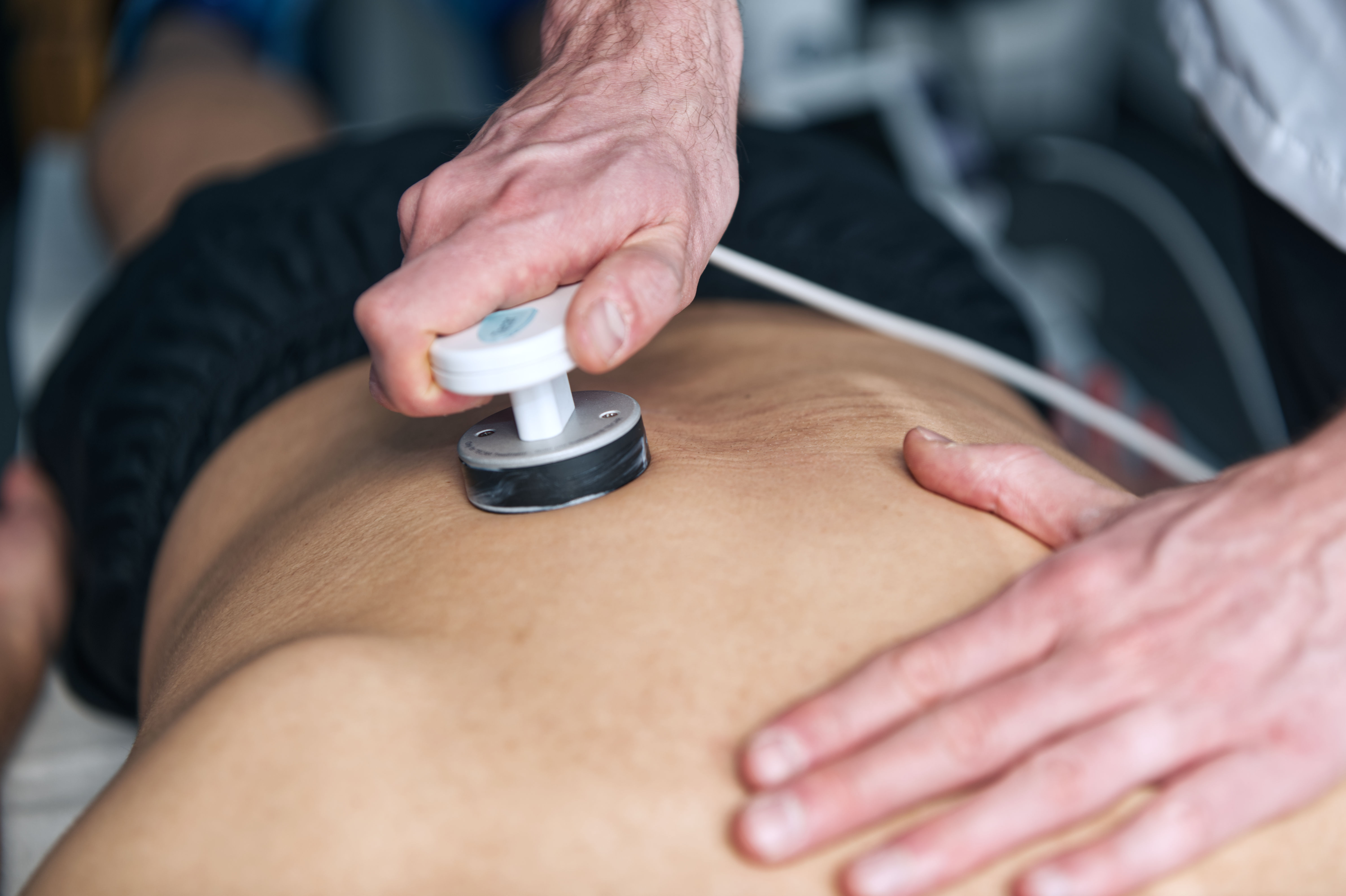 Futuristic glass tablet displaying a glowing blueprint-like interface against a dark background. It conveys a sleek, modern, and high-tech aesthetic.