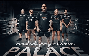 Group of men standing with Sufboard