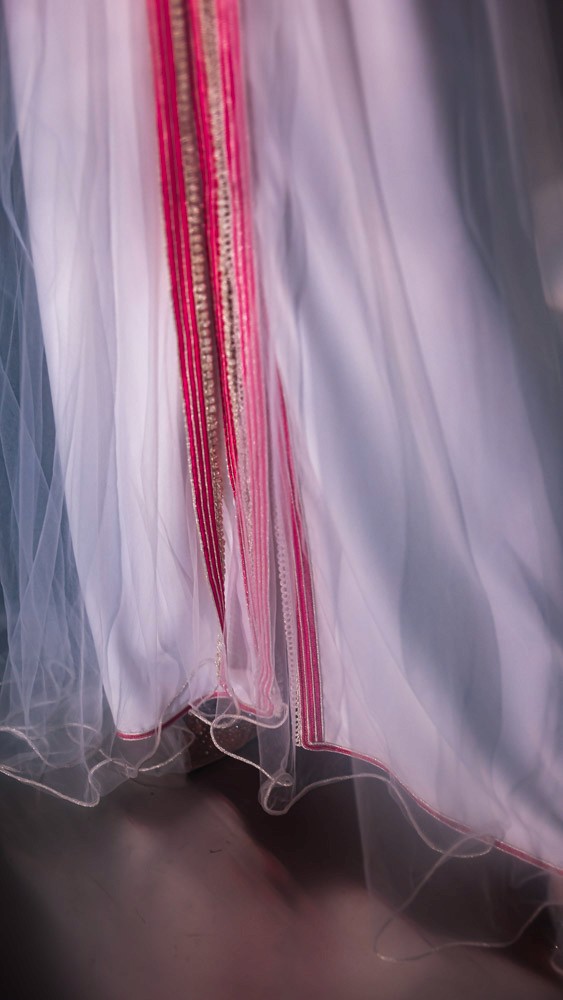 Blush pink Moroccan caftan with delicate embroidery, handcrafted luxury design for refined occasions in Bahrain