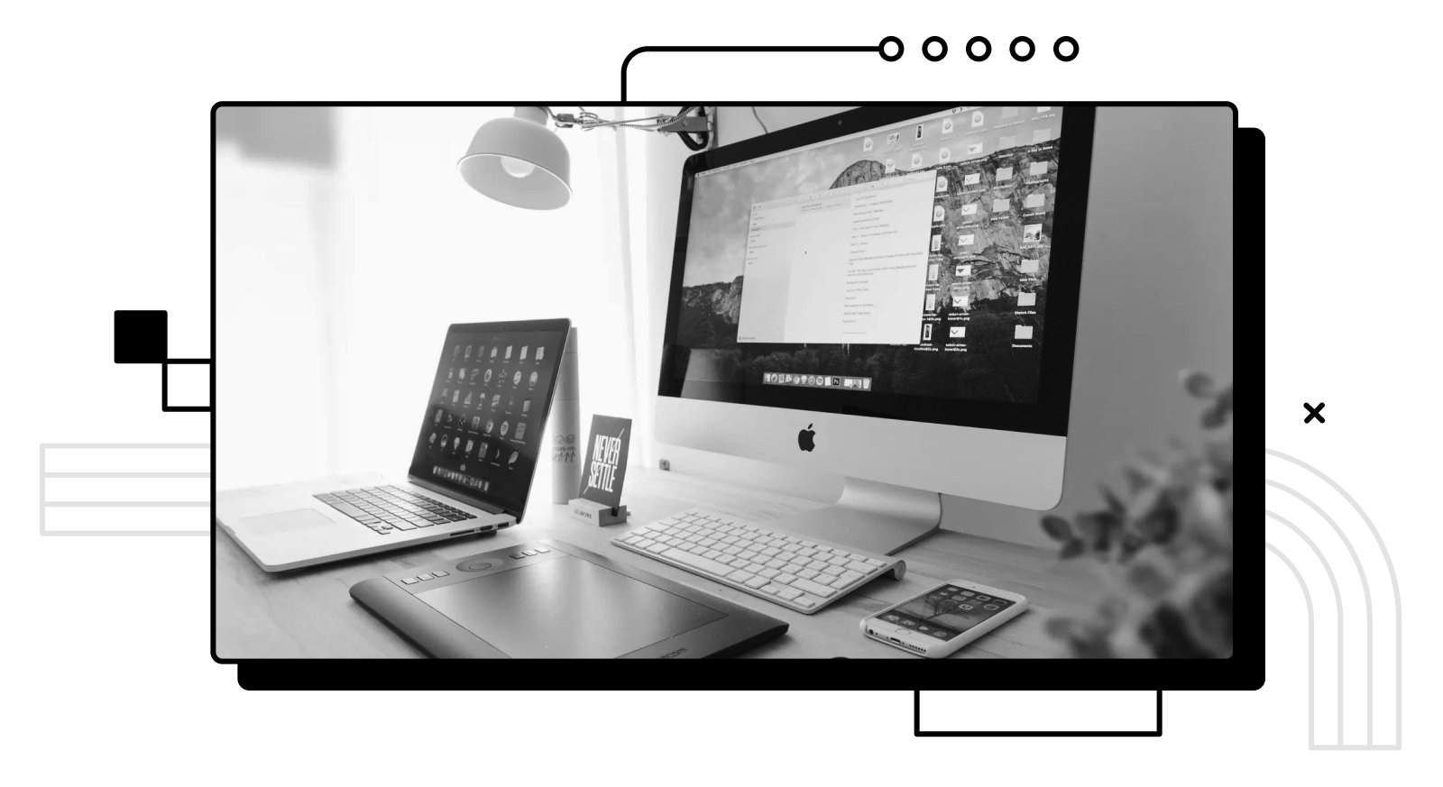 A photo of a laptop and a iMac.