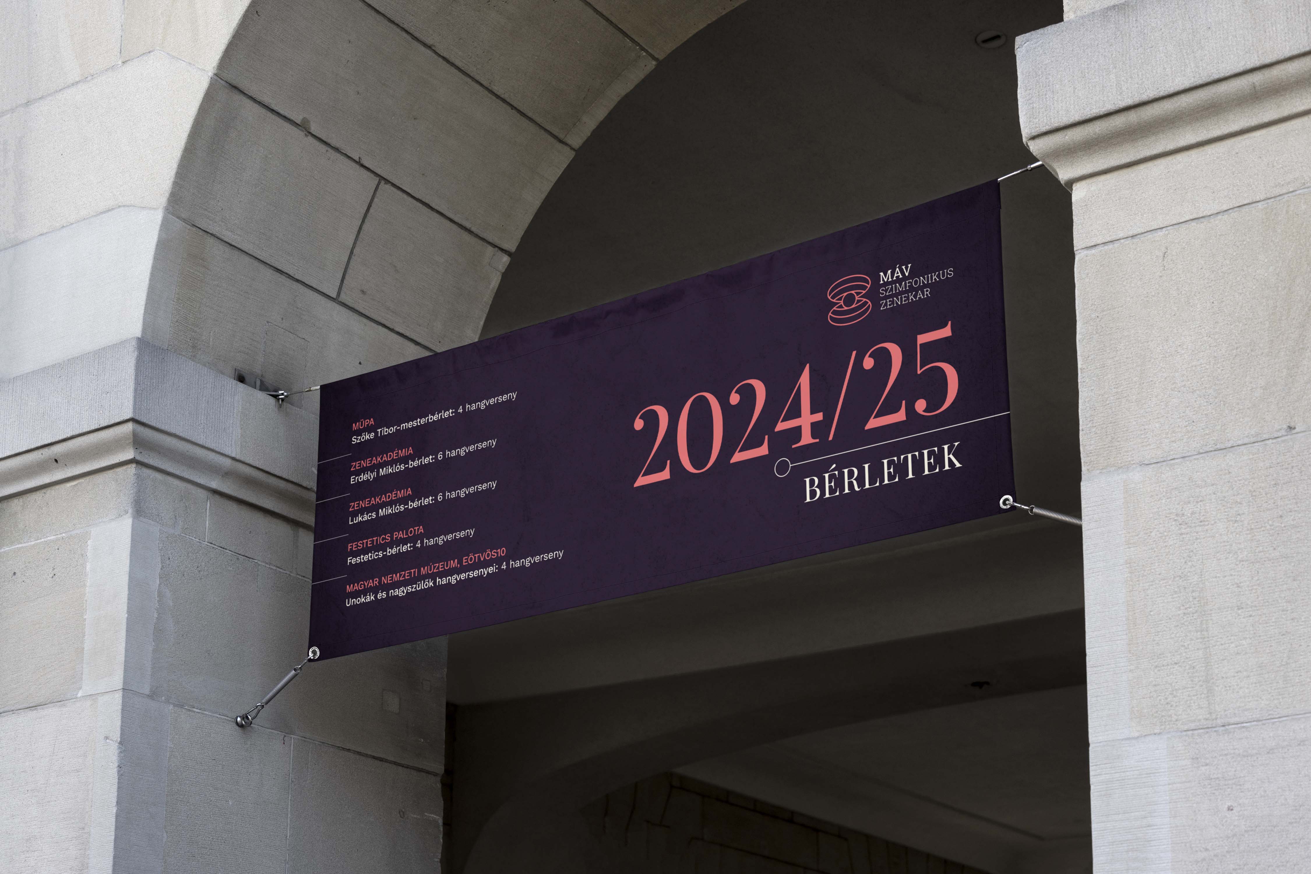 Hanging seasonal banner under an archway announcing subscription season in purple and coral featuring the V1 logo - MÁV Symphony Orchestra, a symphony orchestra brand identity.