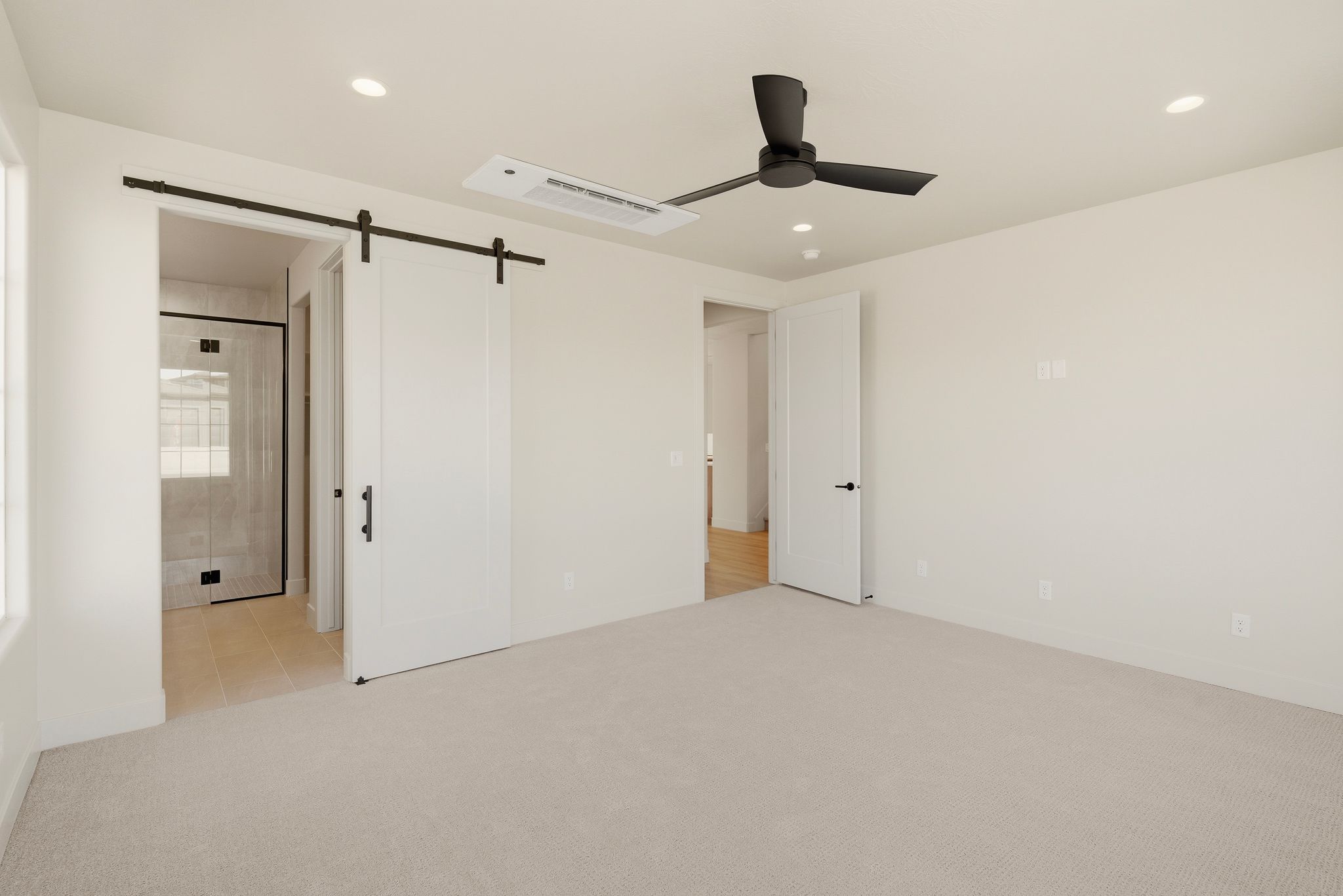 Master suite in The View at Falcon Ridge, Hurricane, Utah, showcasing a serene retreat with room for seating or furnishings.