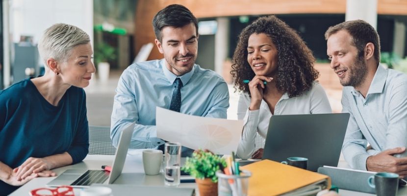Four people discussing marketing strategy